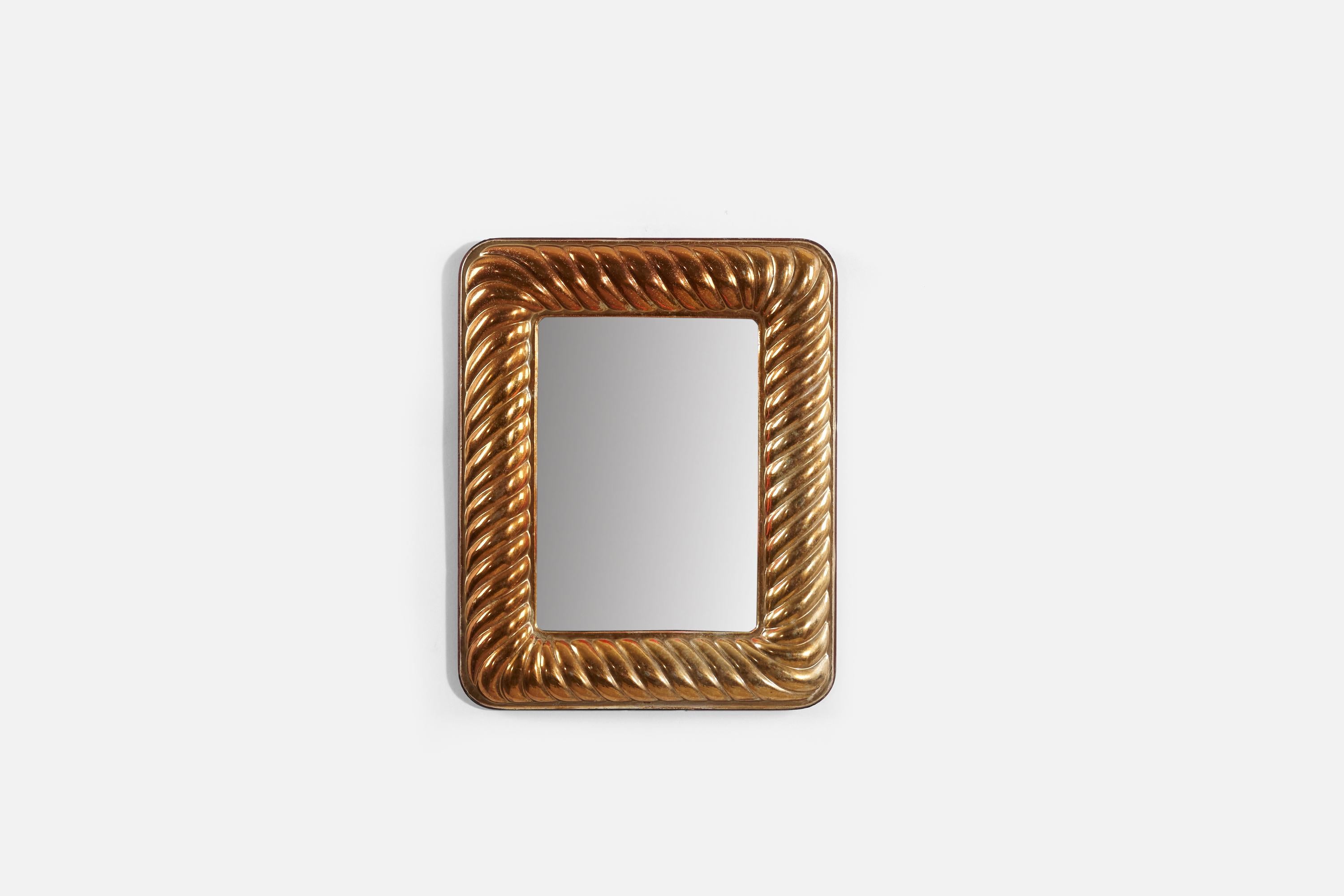 A copper wall mirror produced in Italy, 1950s.
 