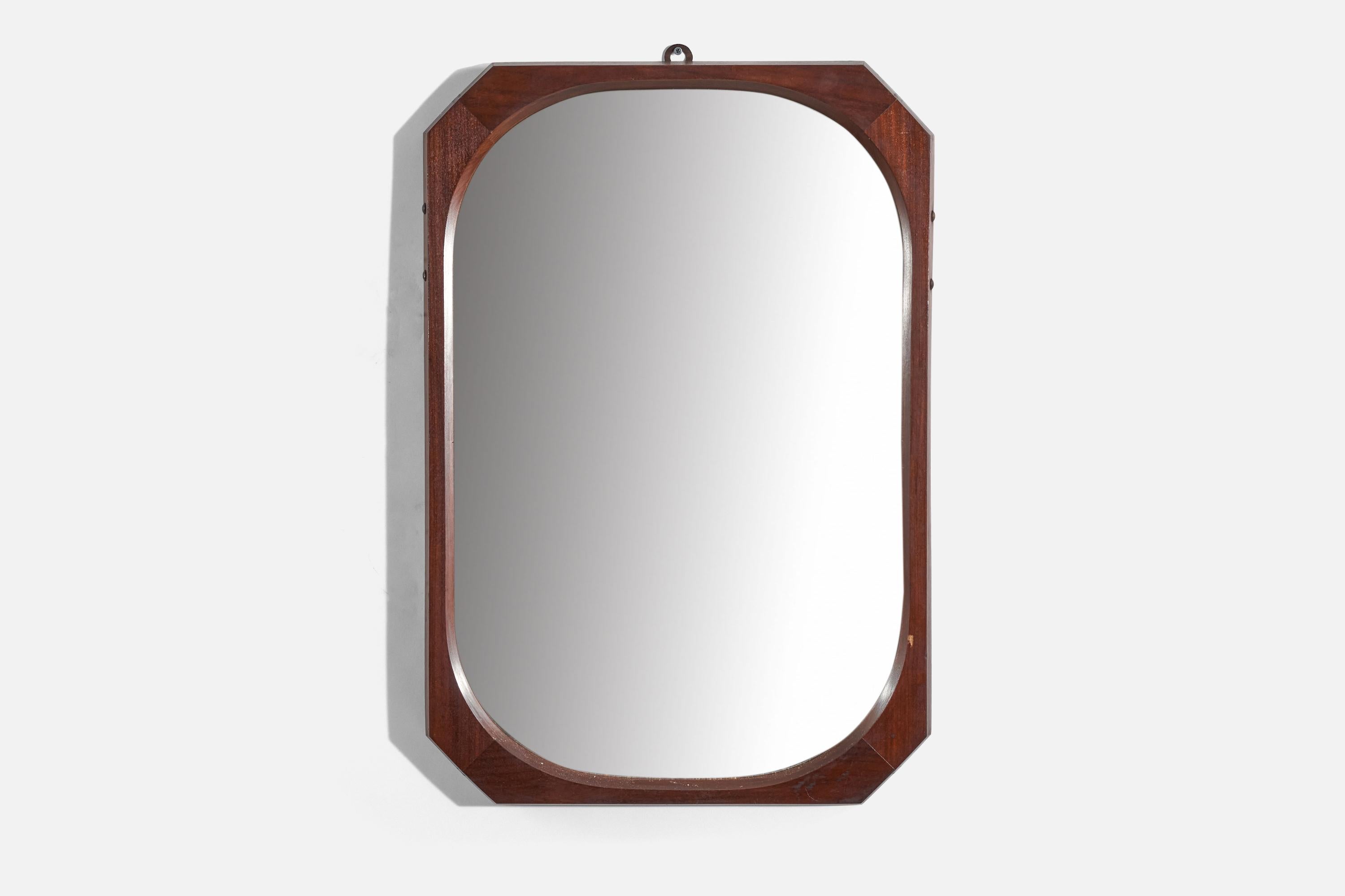 A dark-stained wooden wall mirror designed and produced in Italy, c. 1950s.
 