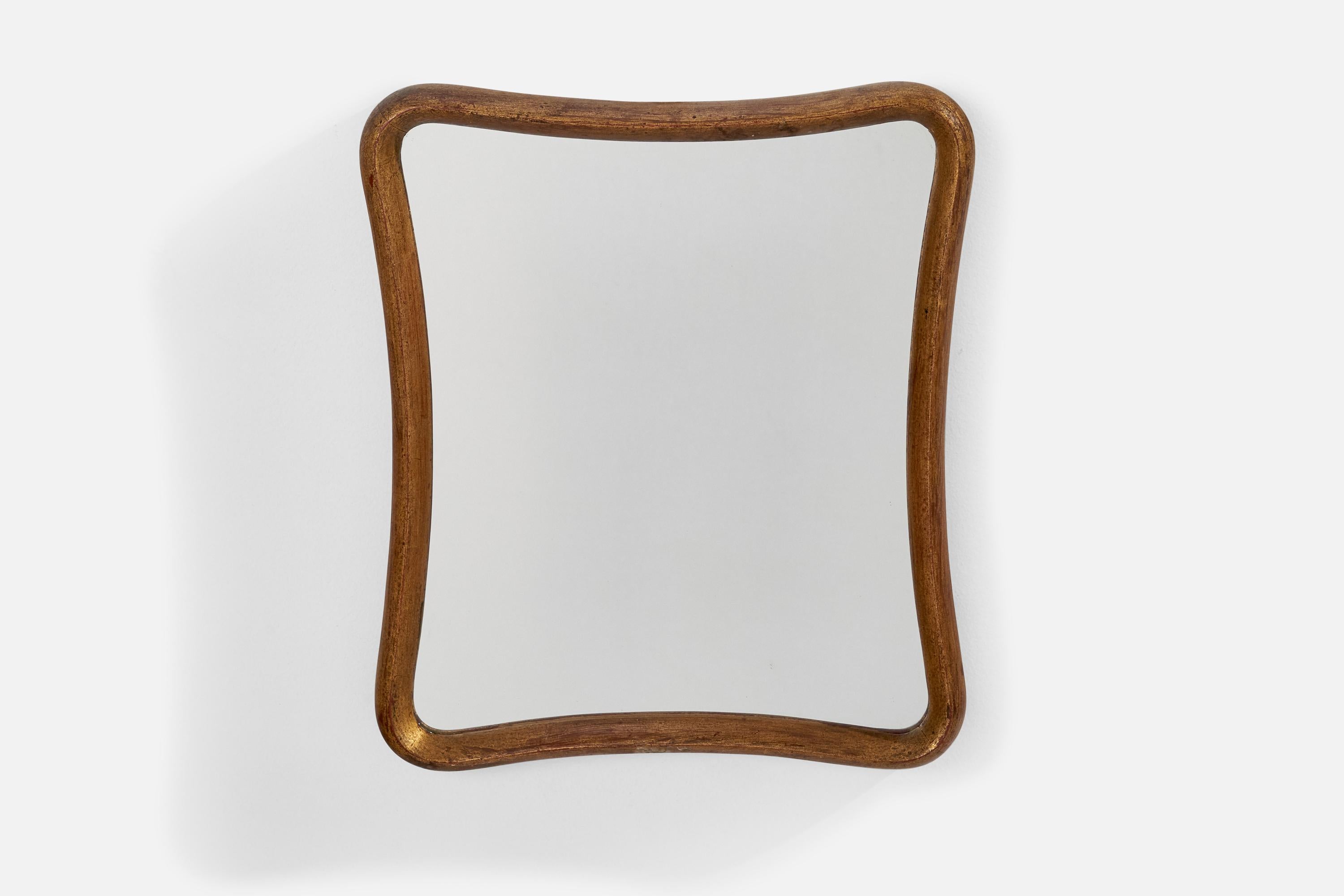 Specchio da parete in legno dorato prodotto in Italia, anni '40 circa. 
 