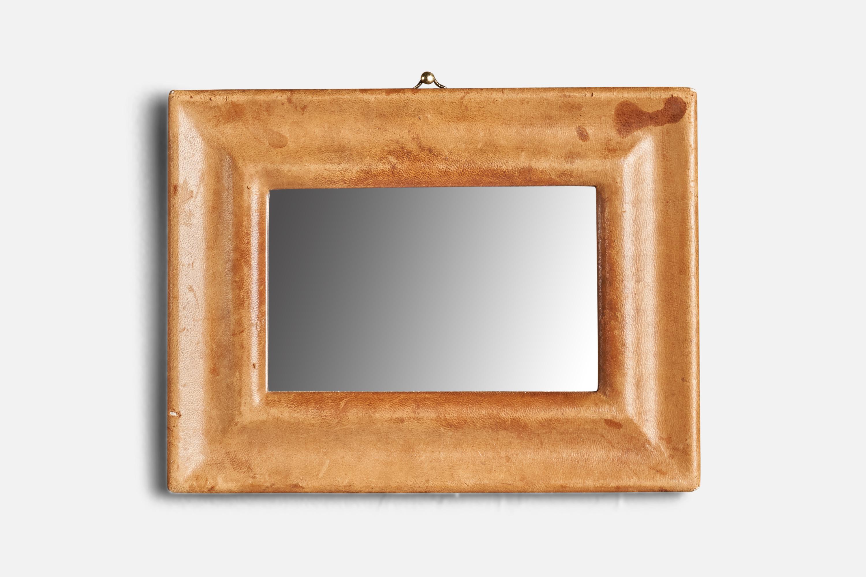A leather wall mirror designed and produced in Italy, 1940s.