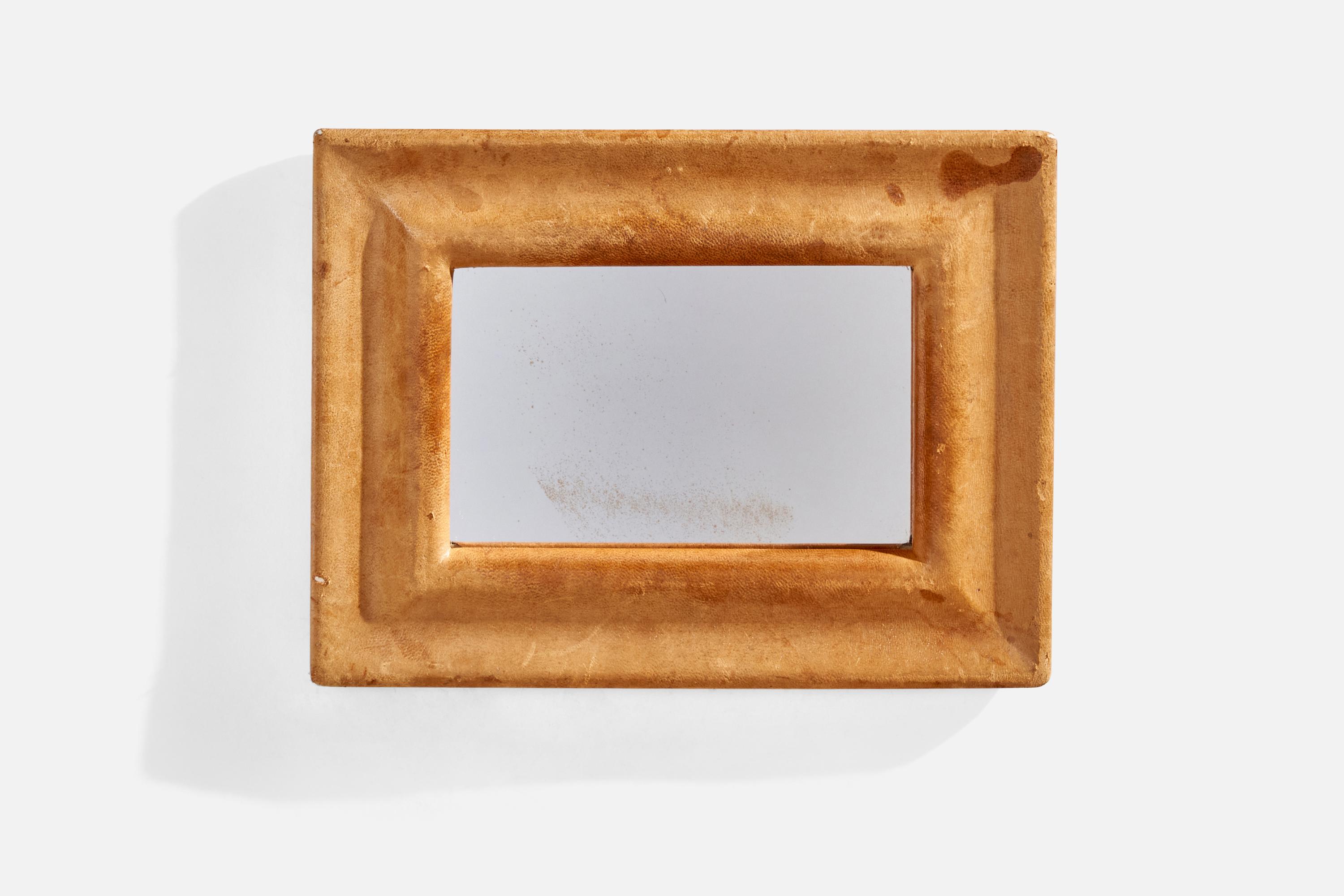 A leather wall mirror designed and produced in Italy, 1940s.
