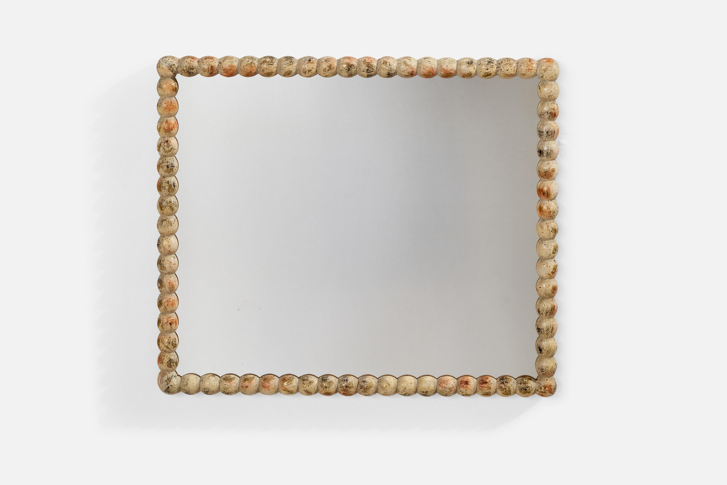 Miroir mural en bois peint et semi-doré produit en Italie, années 1940.
 