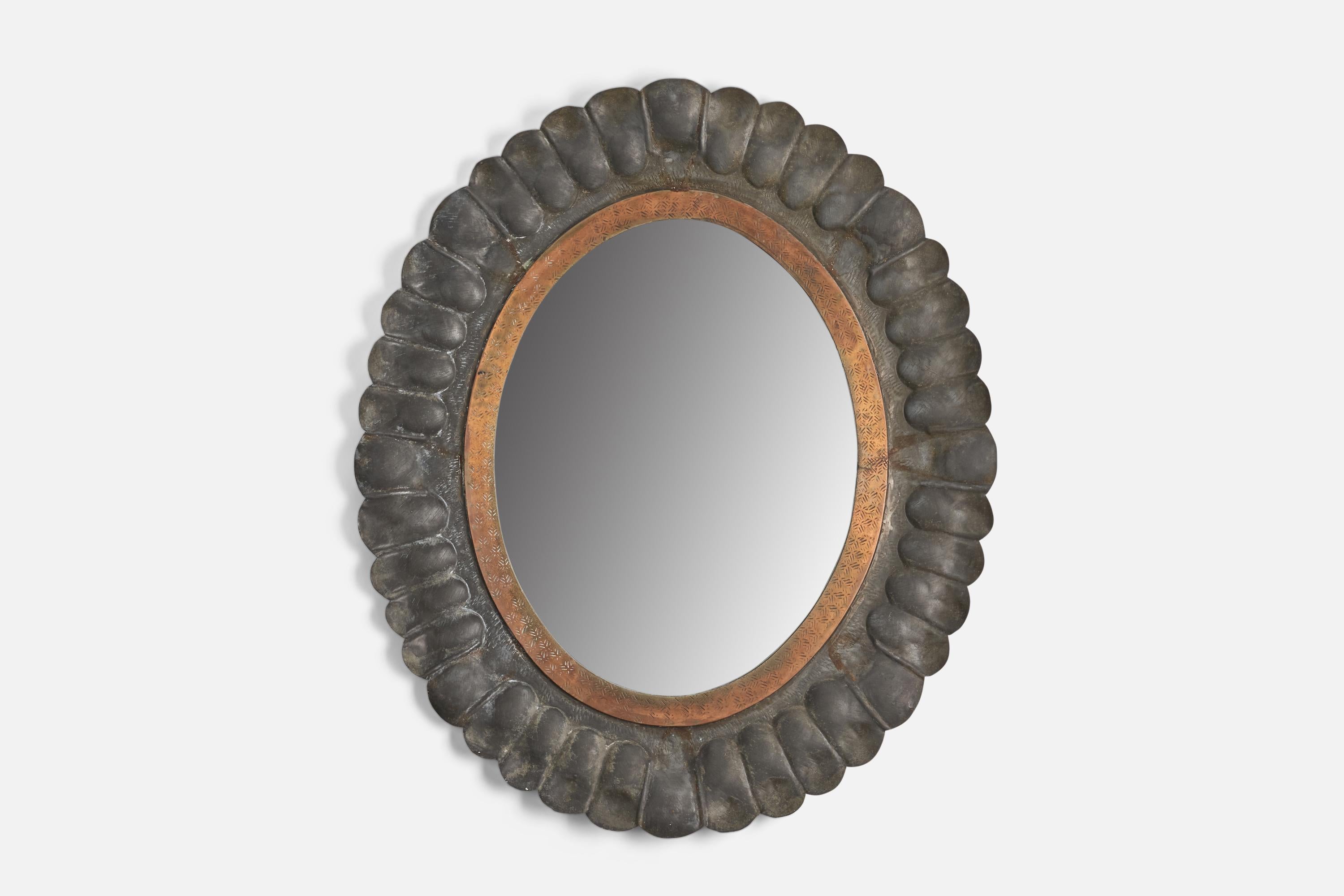 A pewter and copper wall mirror designed and produced by an Italian Designer, Italy, 1930s.