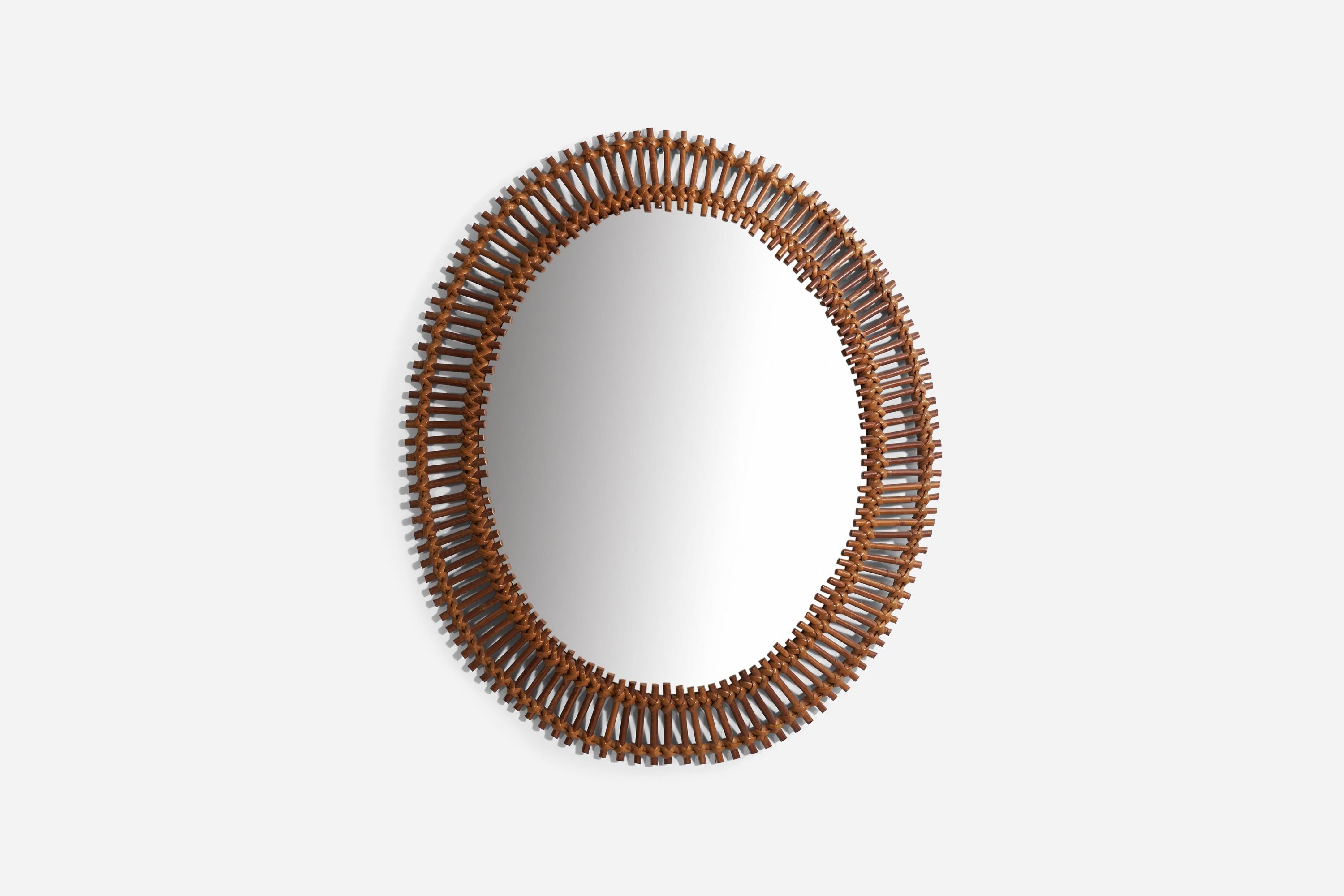 A bamboo and rattan wall mirror produced in Italy, 1950s. 

 