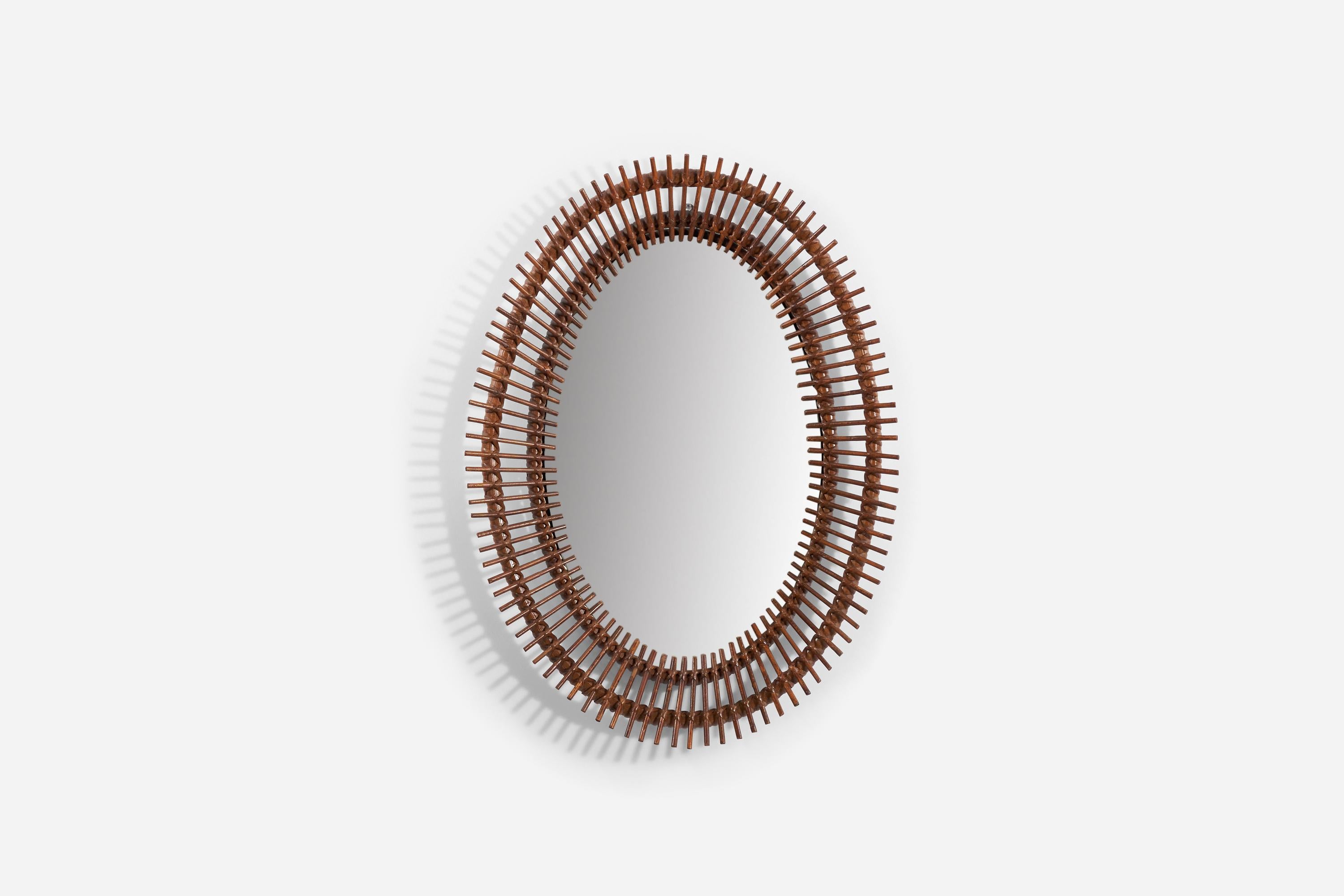A bamboo and rattan wall mirror produced in Italy, 1950s.
 