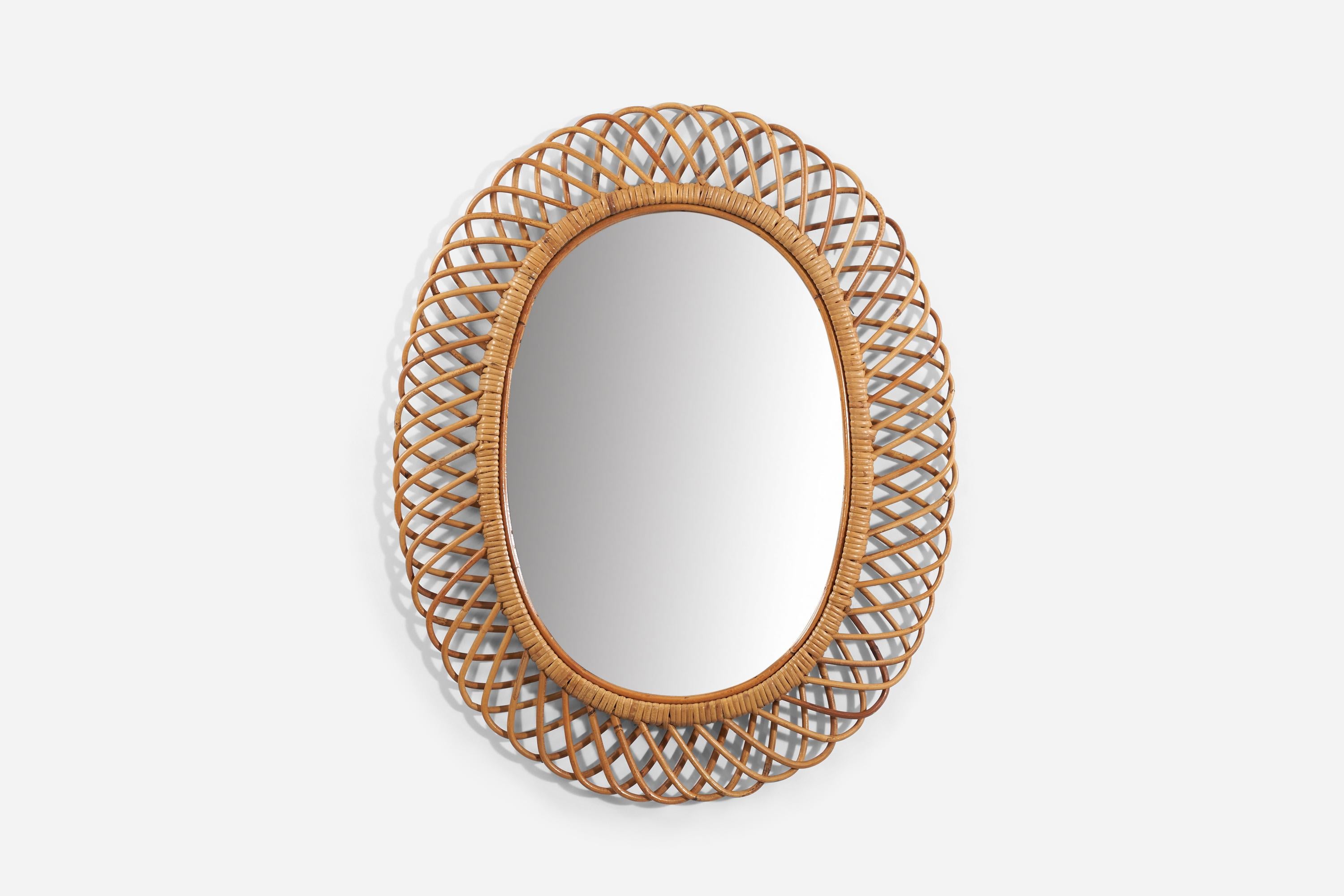 A bamboo and rattan wall mirror produced in Italy, 1950s.
 