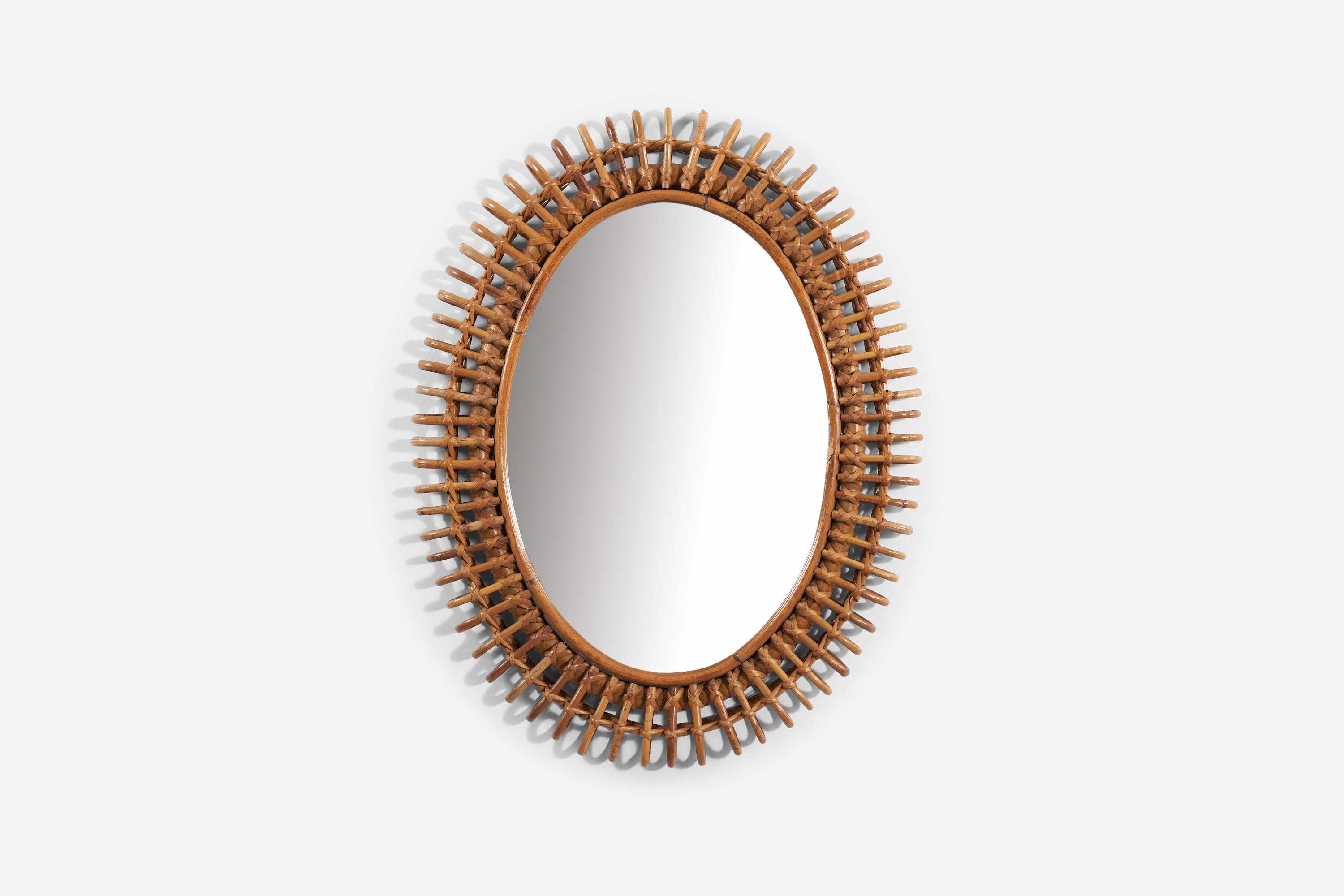 A bamboo and rattan wall mirror produced in Italy, 1950s.
 