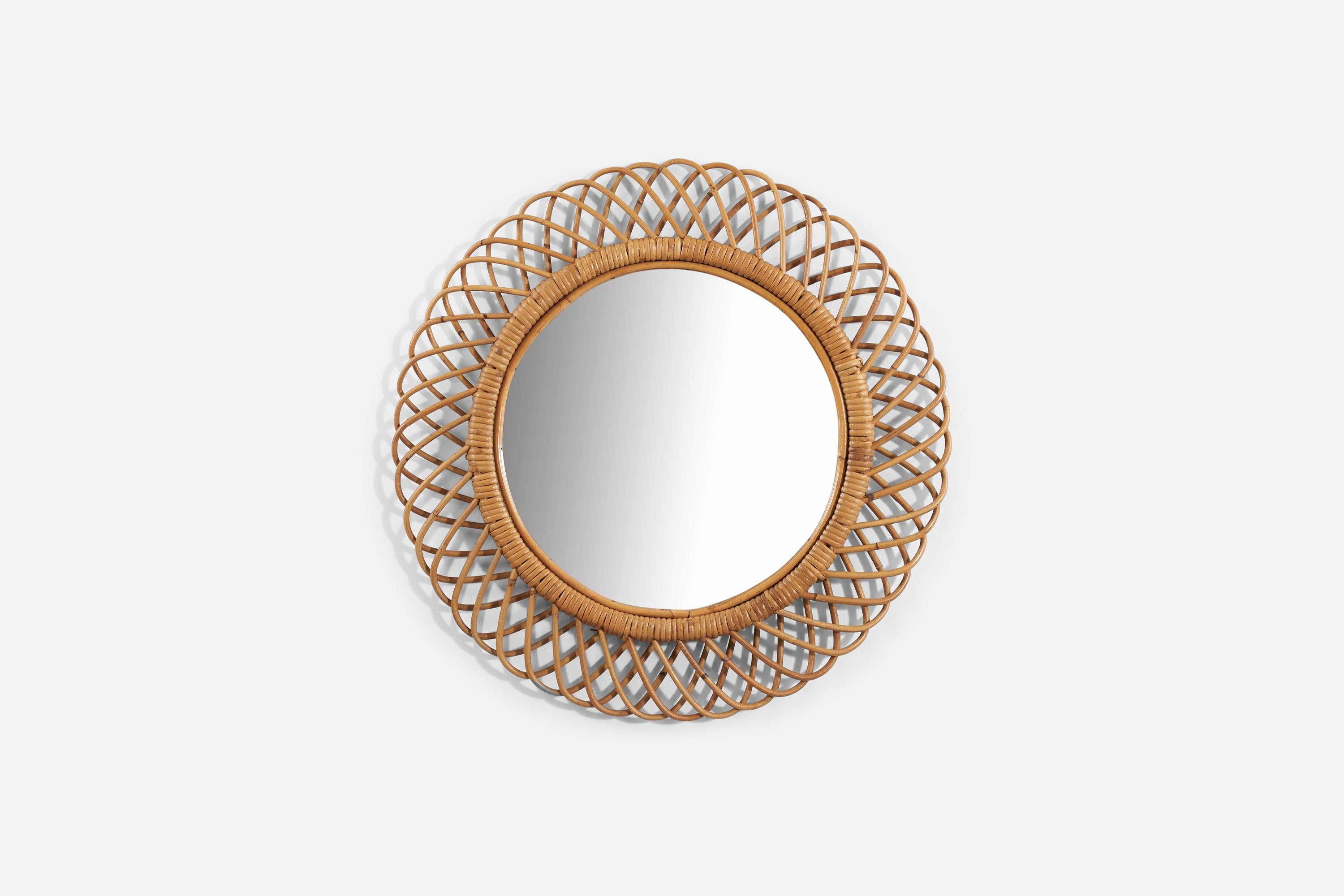 A bamboo and rattan wall mirror produced in Italy, 1950s. 
 