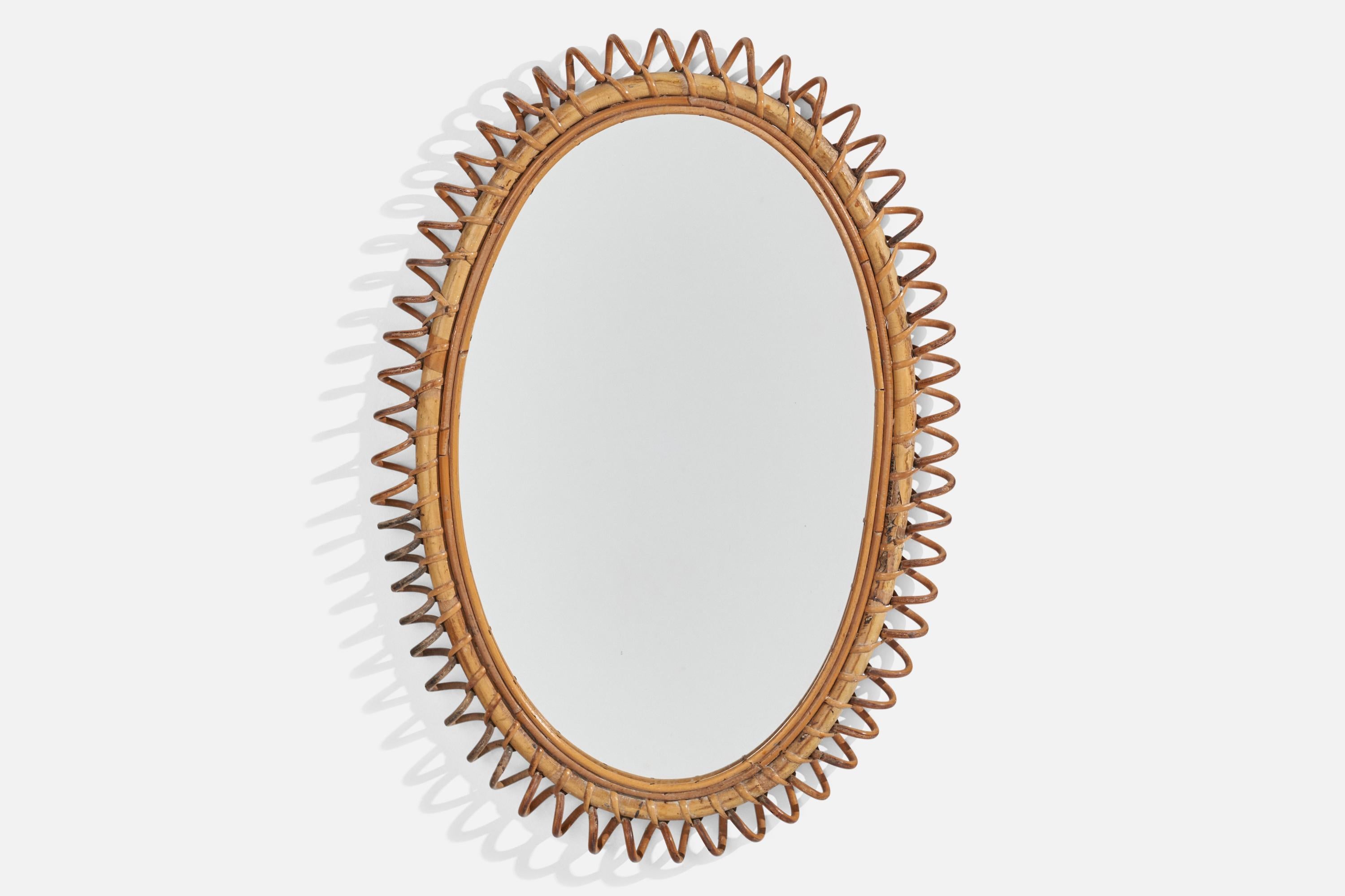 A moulded bamboo and rattan wall mirror designed and produced in Italy, 1950s.