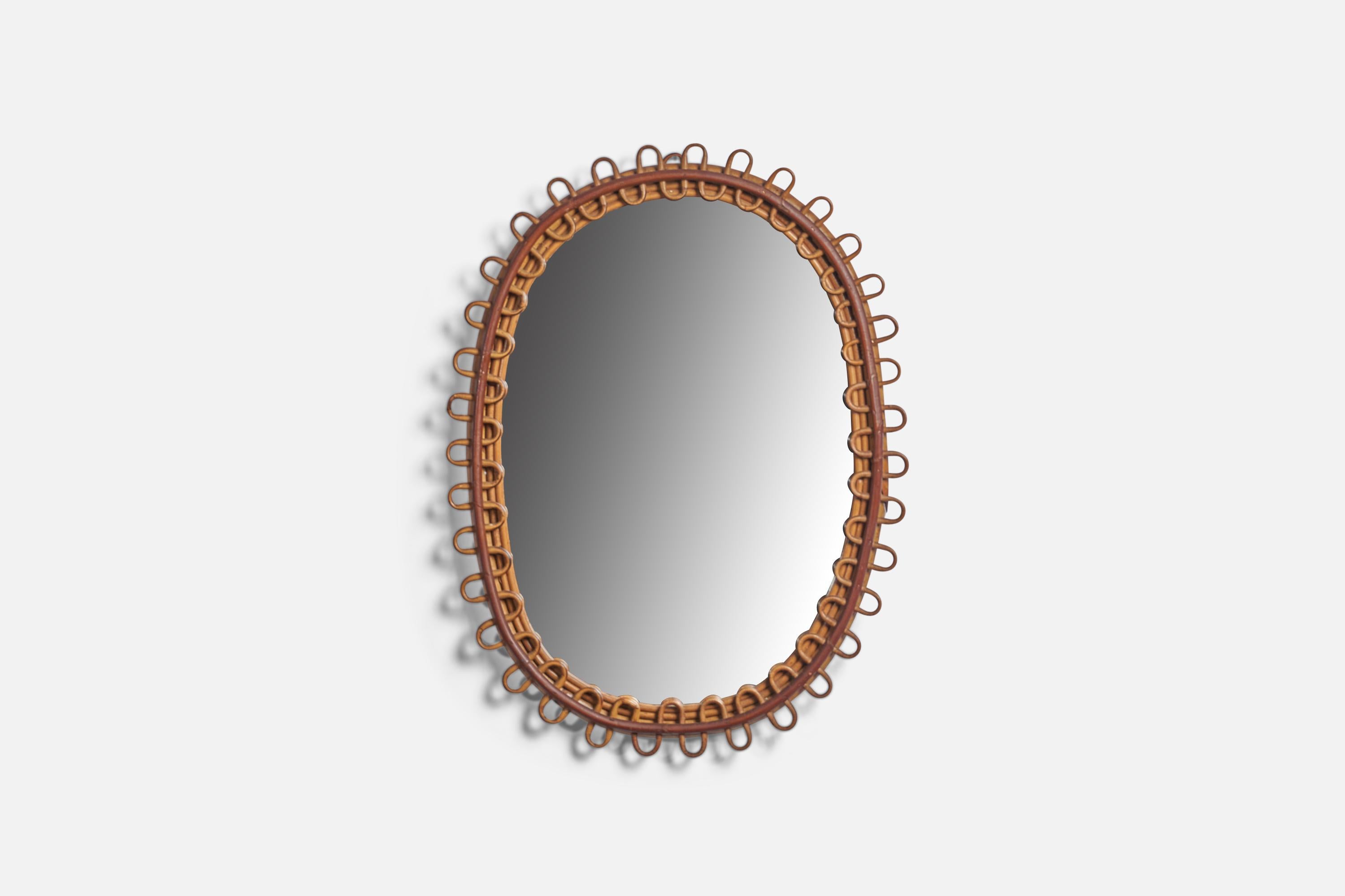 An oval bamboo and rattan mirror, designed and produced in Italy, c. 1950s.