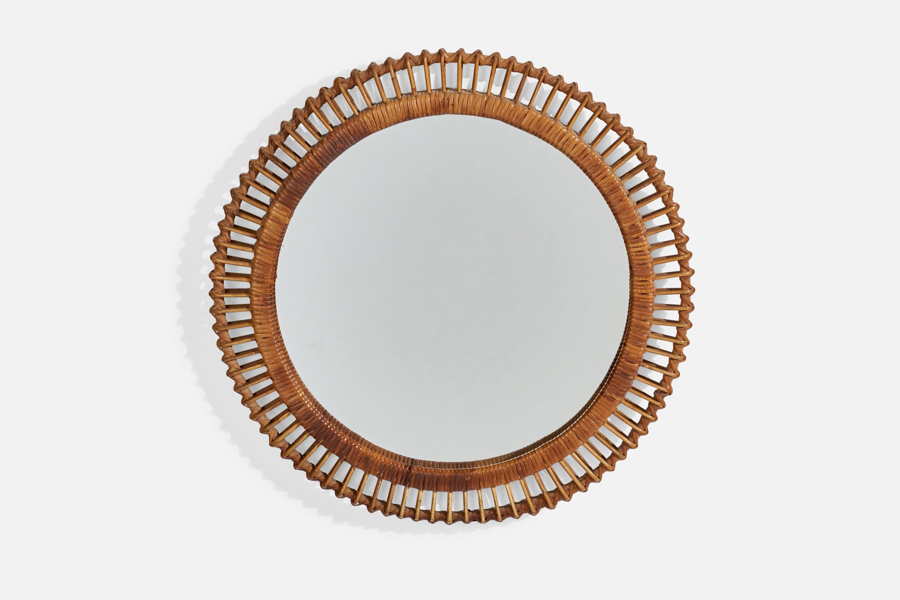 A rattan and bamboo wall mirror designed and produced by an Italian Designer, Italy, 1960s.