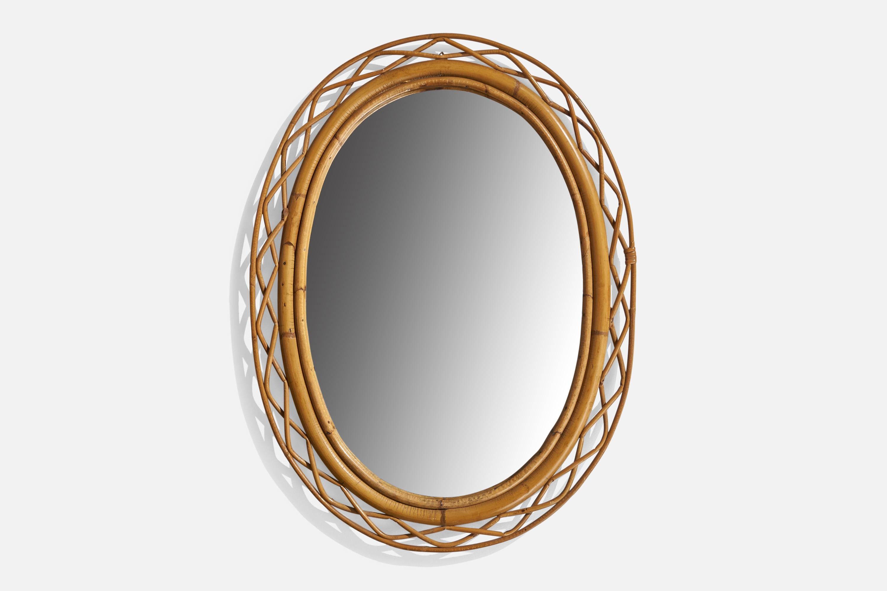 A rattan and bamboo wall mirror designed and produced in Italy, 1960s.