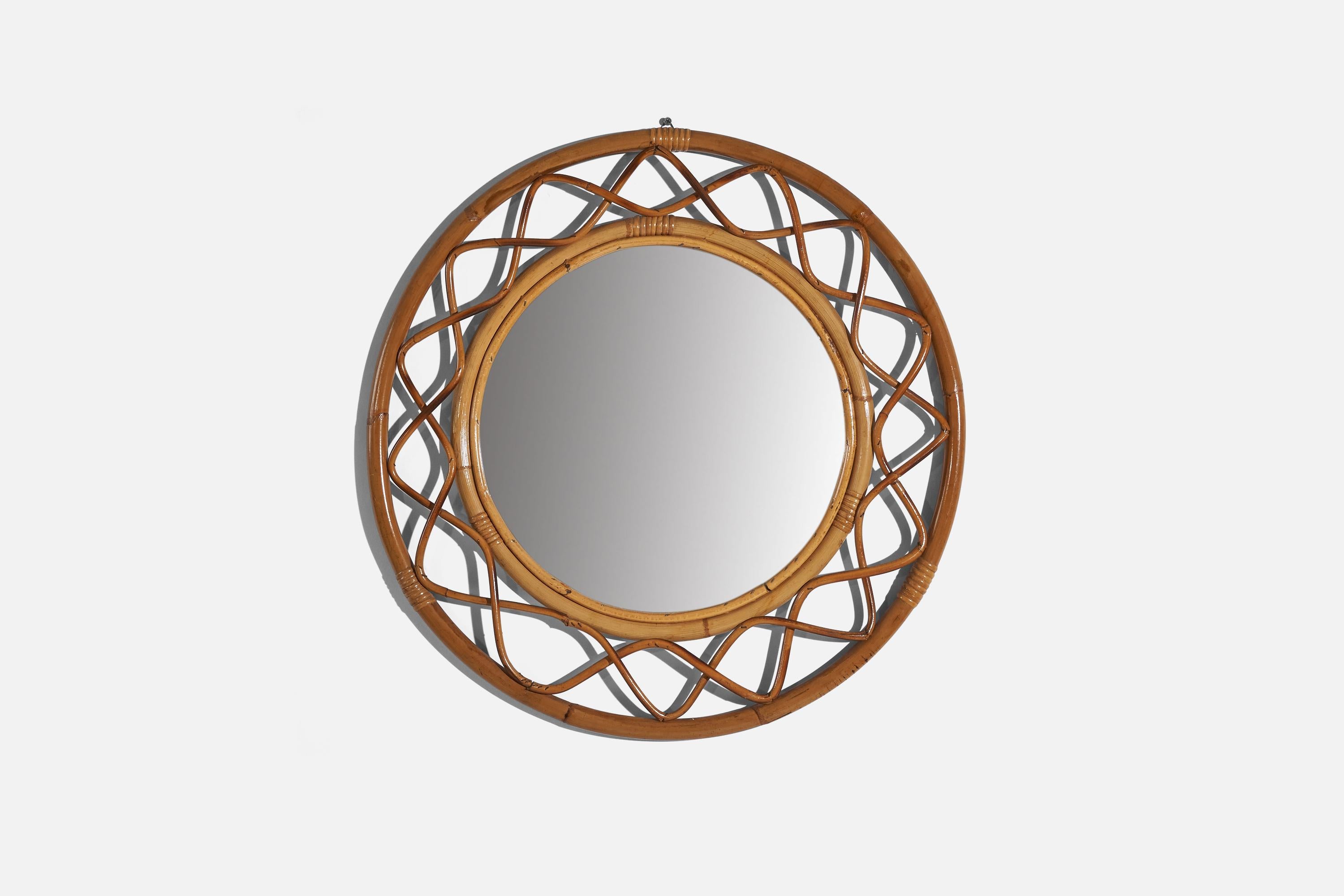 A bamboo and rattan wall mirror designed and produced by an Italian designer, Italy, 1950s-1960s.
 