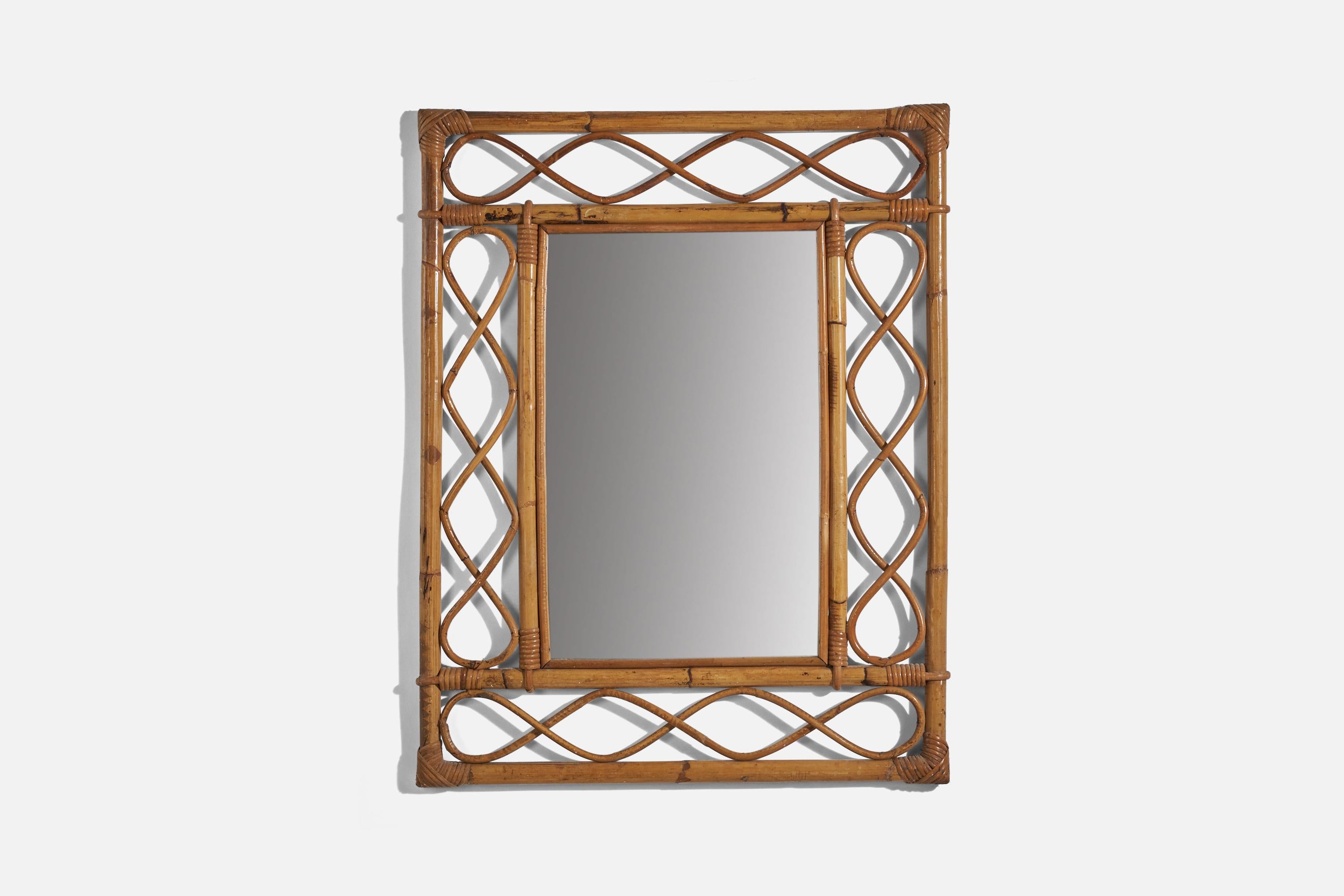 A rattan and bamboo wall mirror designed and produced in Italy, 1950s. 