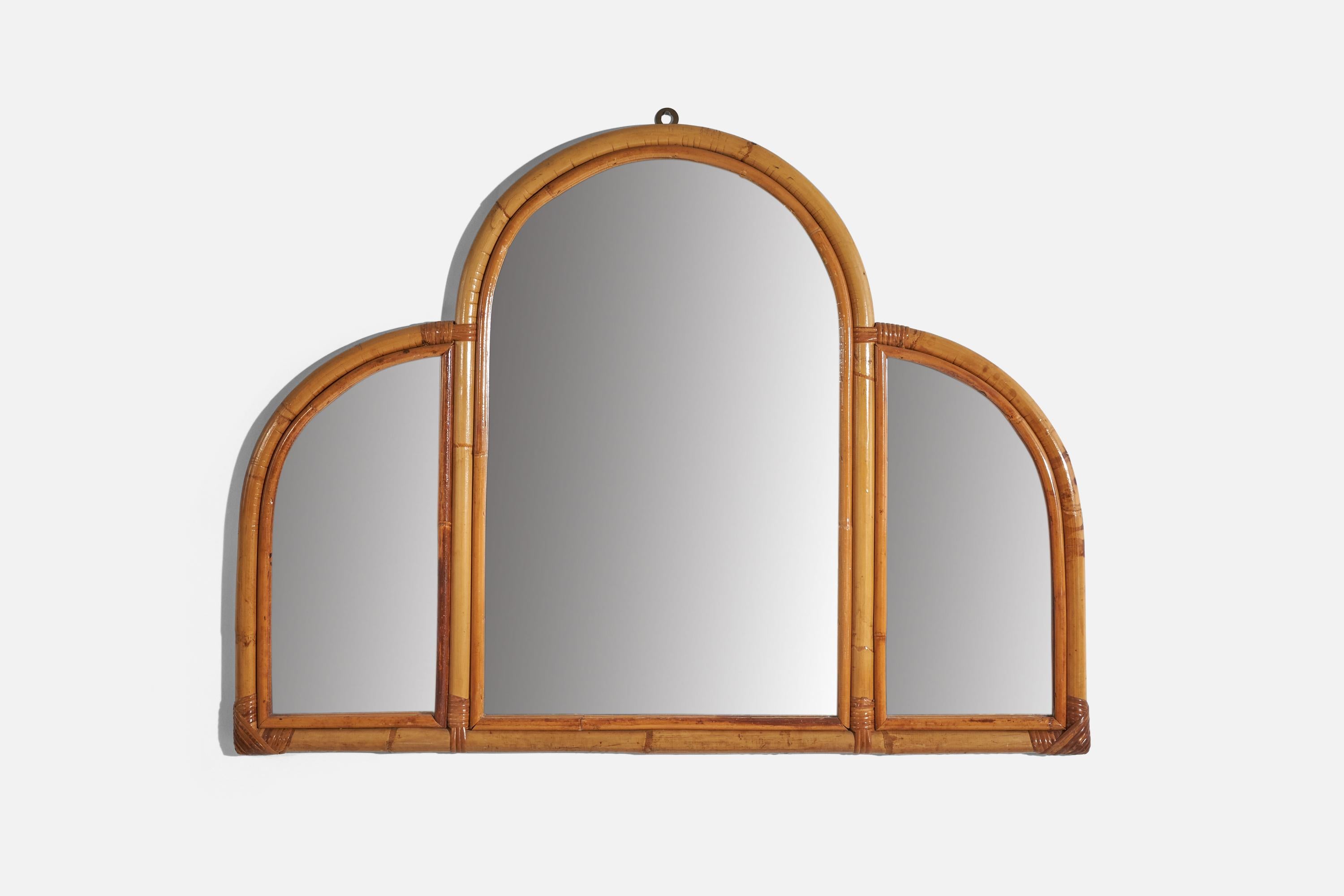 A bamboo and rattan wall mirror produced in Italy, c. 1950s-1960s.
 