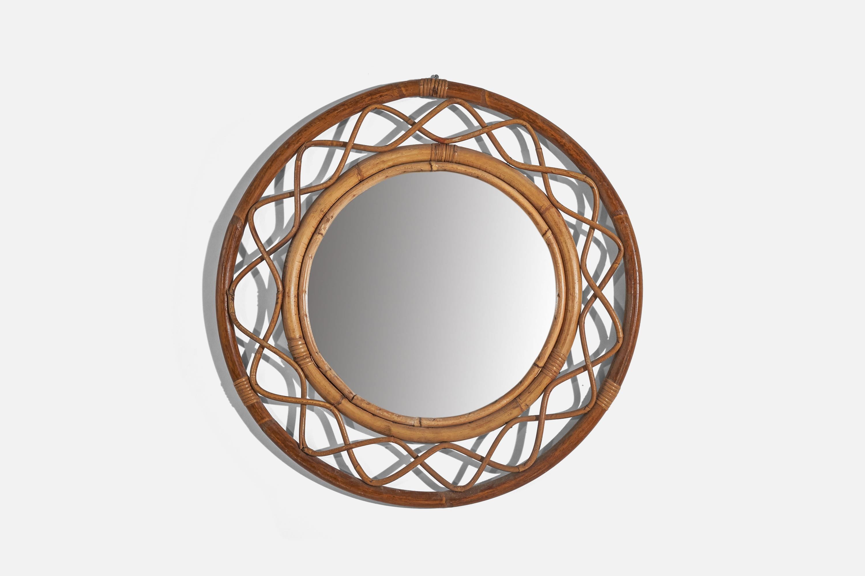 A rattan and bamboo wall mirror designed and produced by an Italian designer, Italy, c. 1960s.
 
