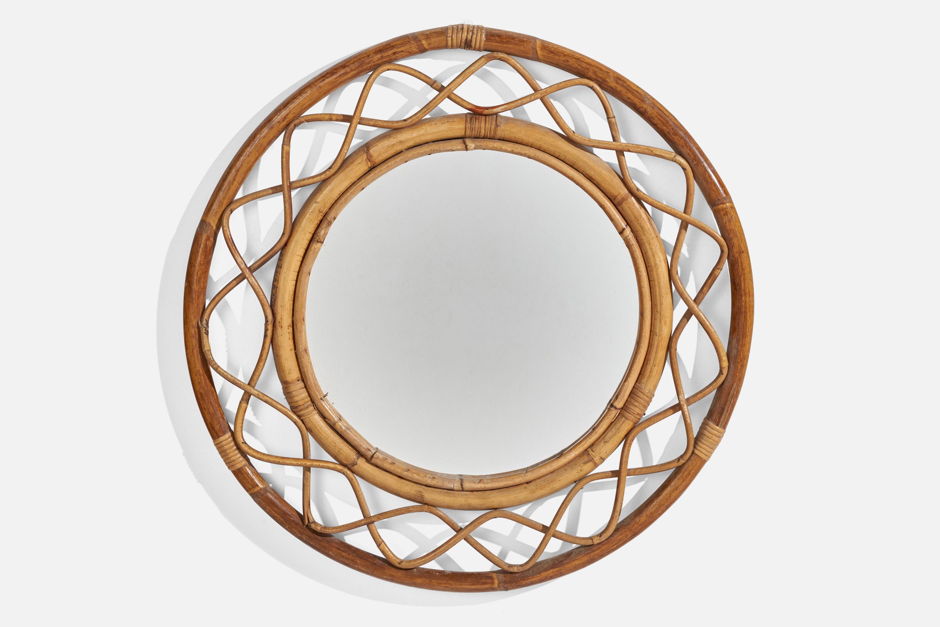 A rattan and bamboo wall mirror designed and produced by an Italian designer, Italy, c. 1960s.
 
