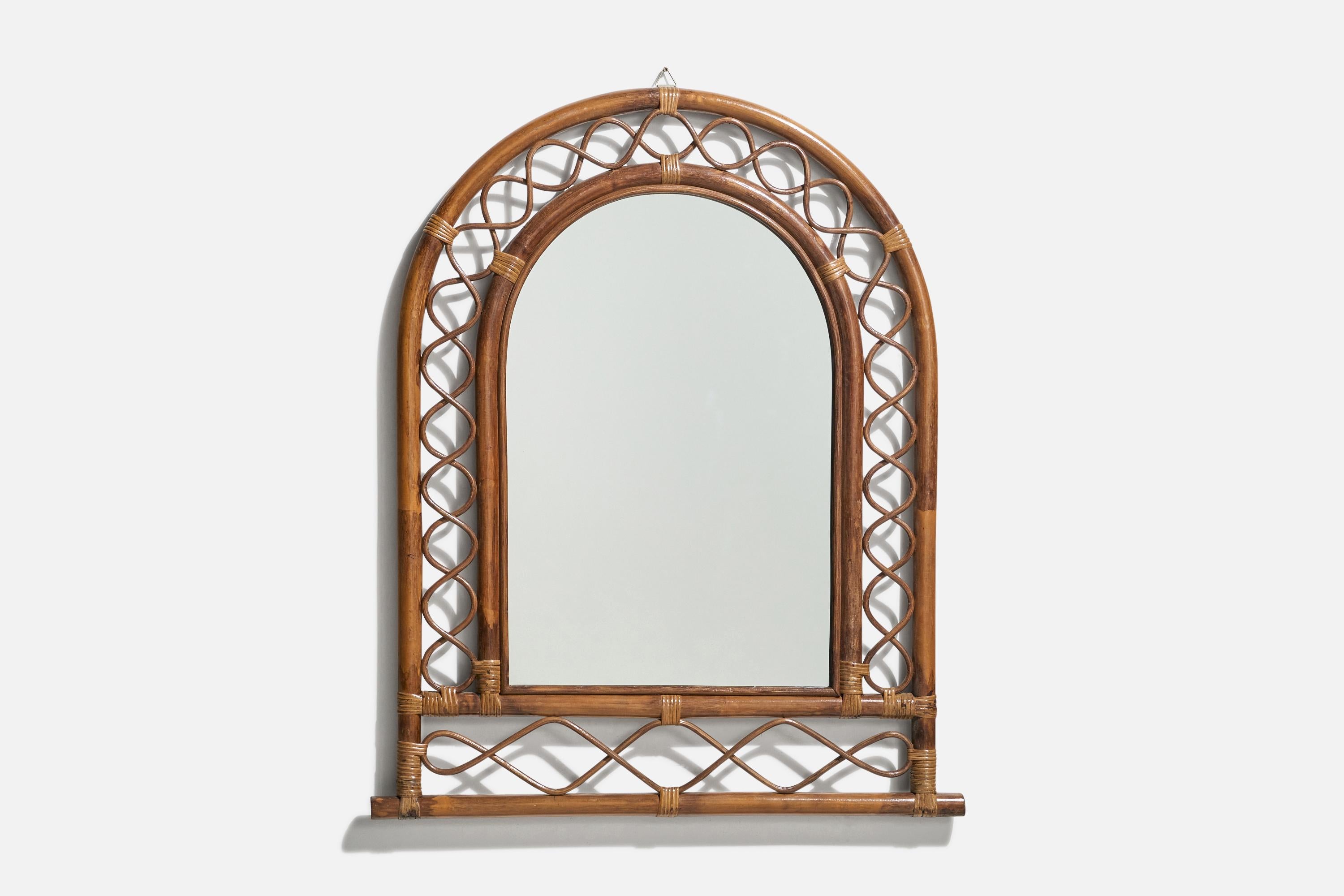 A rattan and bamboo wall mirror designed and produced by an Italian designer, Italy, 1950s-1960s.
    