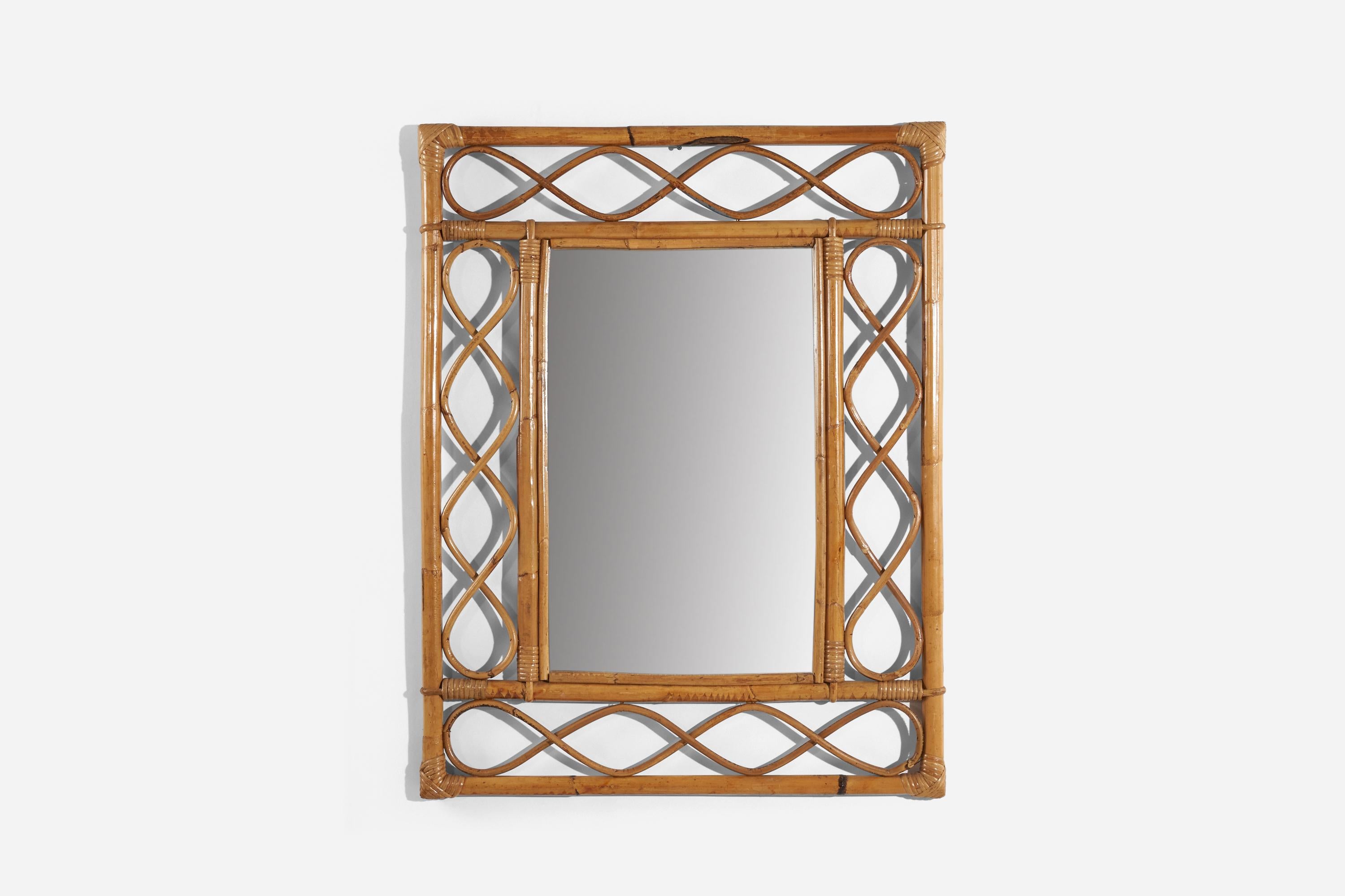 A rattan and bamboo wall mirror designed and produced by an Italian designer, Italy, 1950s-1960s.
 