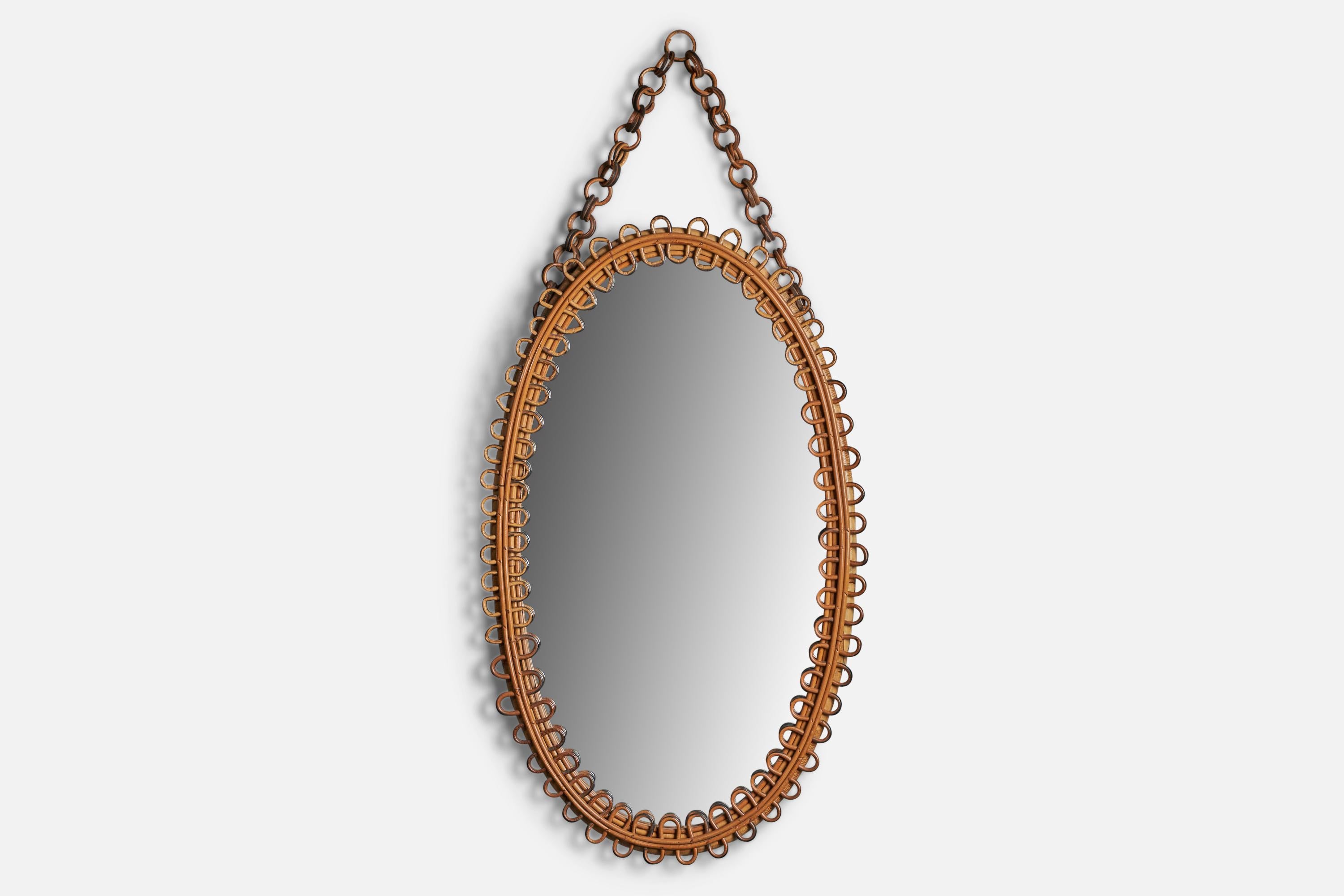 A rattan wall mirror designed and produced in Italy, 1950s.