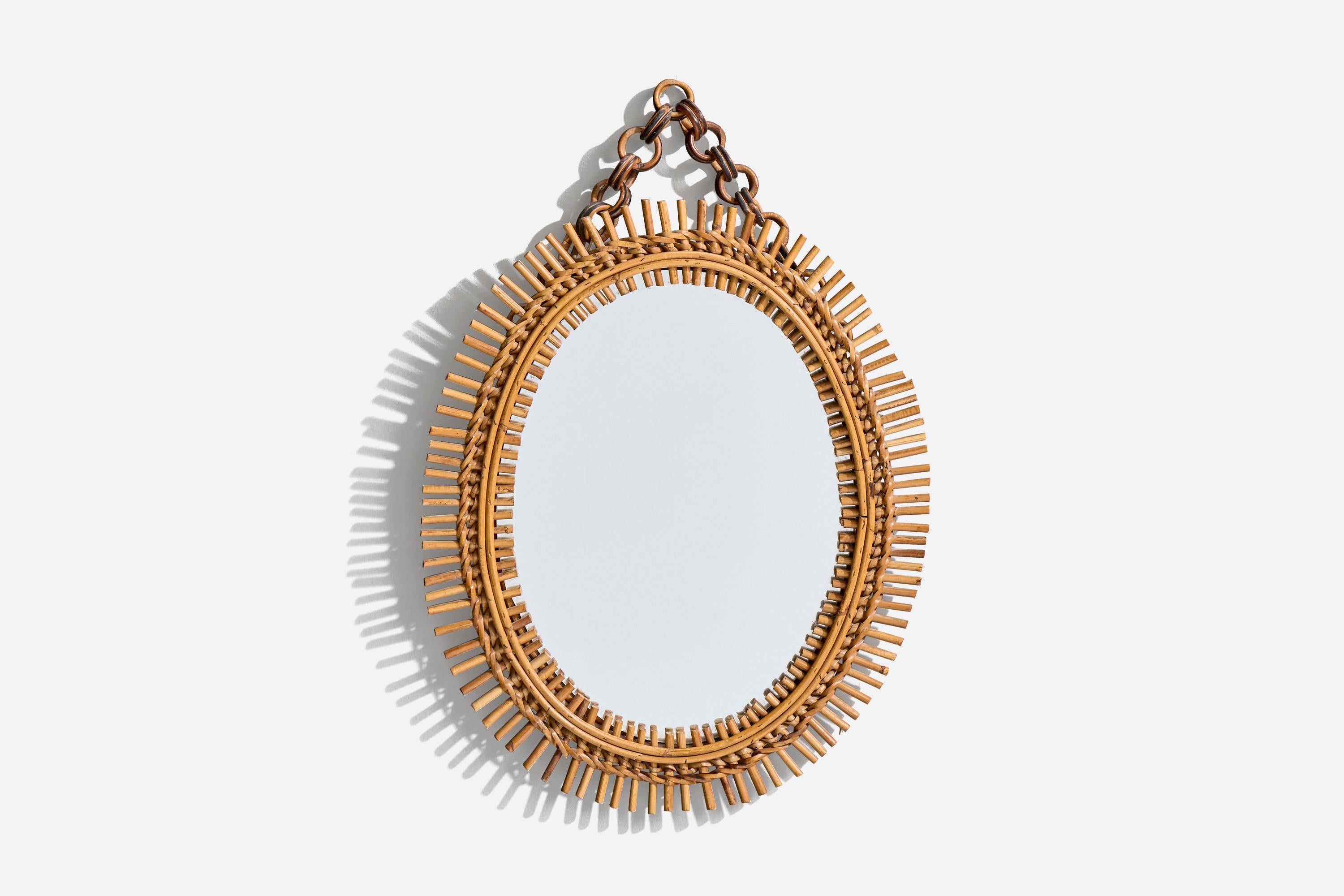 A rattan wall mirror, designed and produced in Italy, 1950s.

Chain adds 3