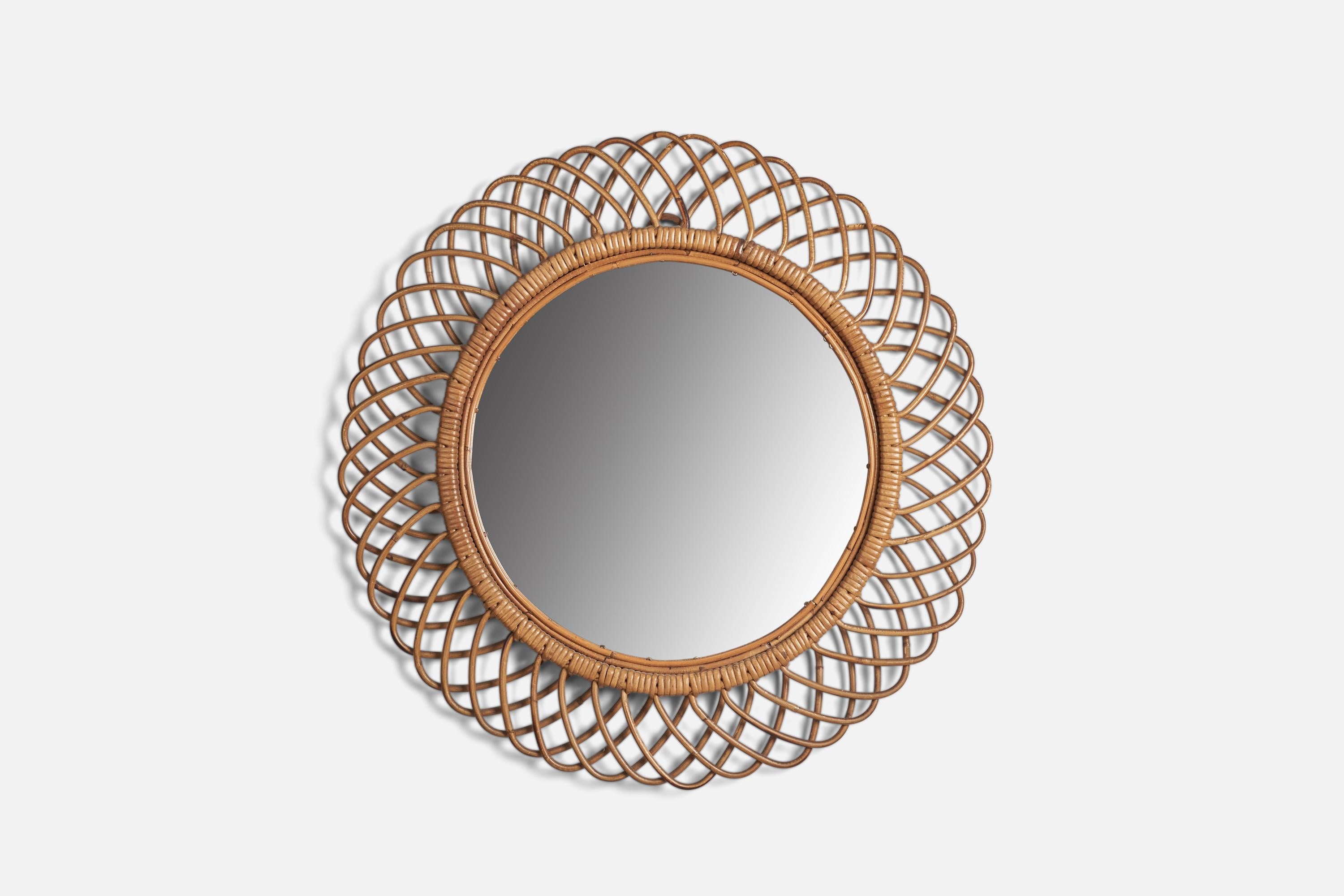 A rattan wall mirror designed and produced by an Italian Designer, Italy, 1960s.