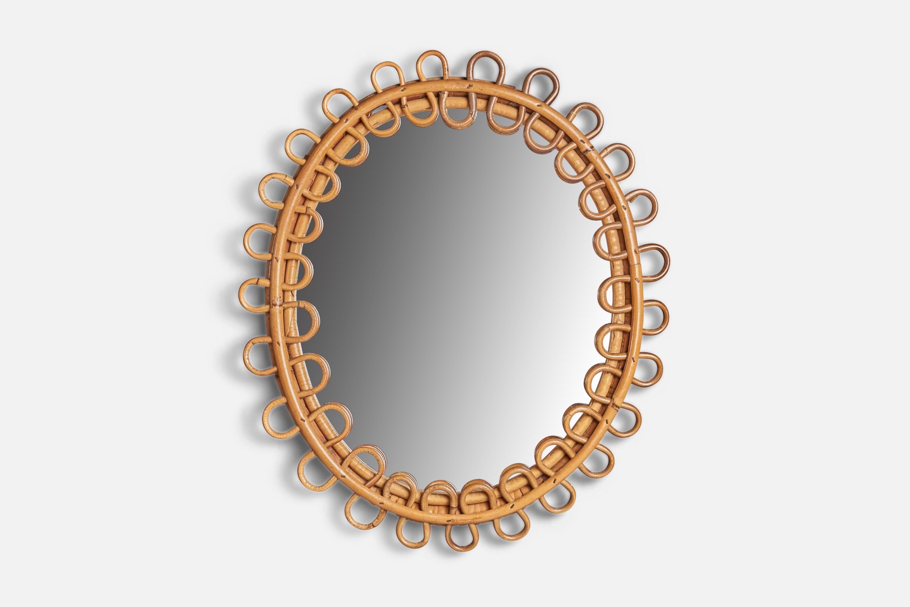 A rattan wall mirror designed and produced by an Italian Designer, Italy, 1960s.