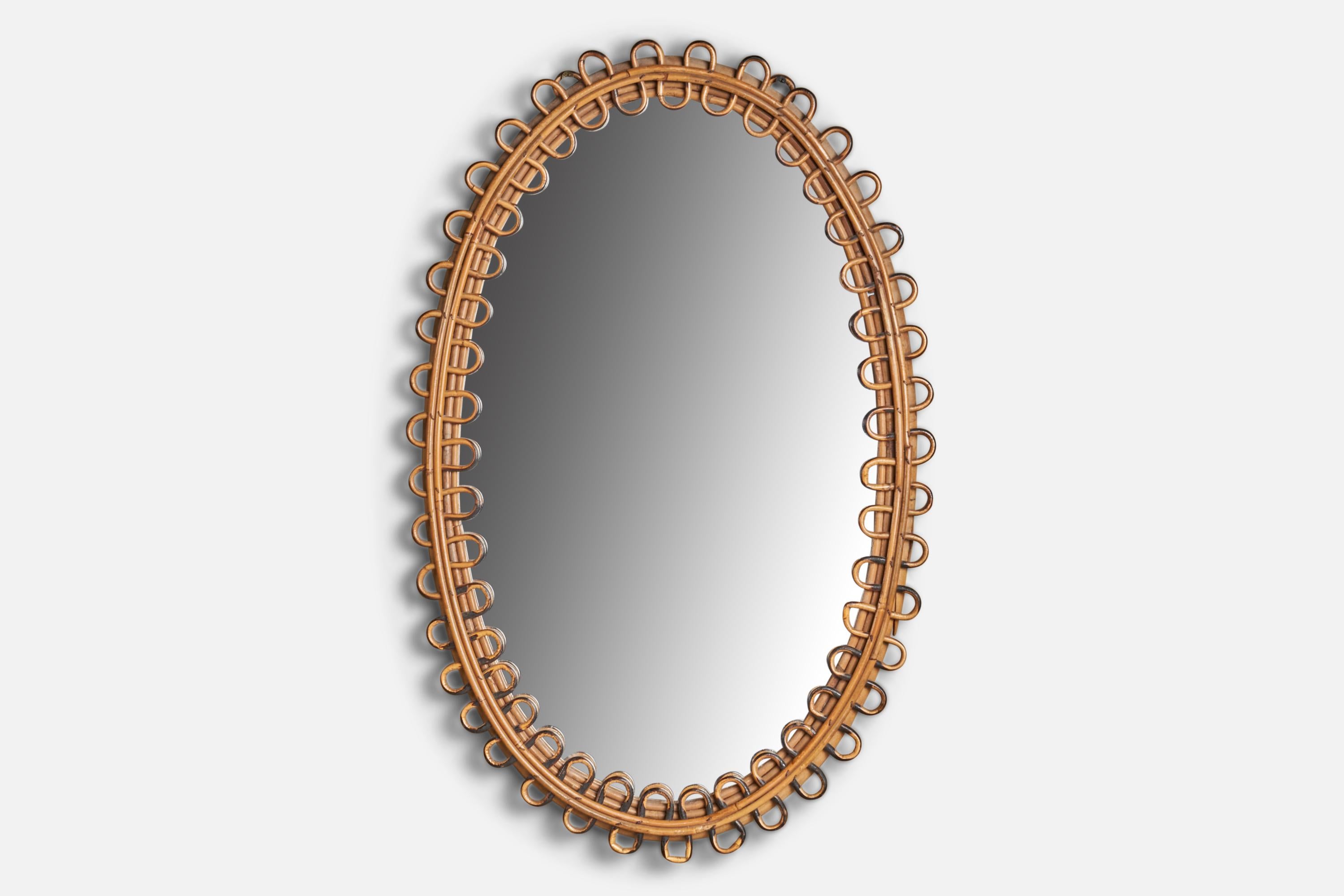 A rattan wall mirror designed and produced in Italy, c. 1960s.