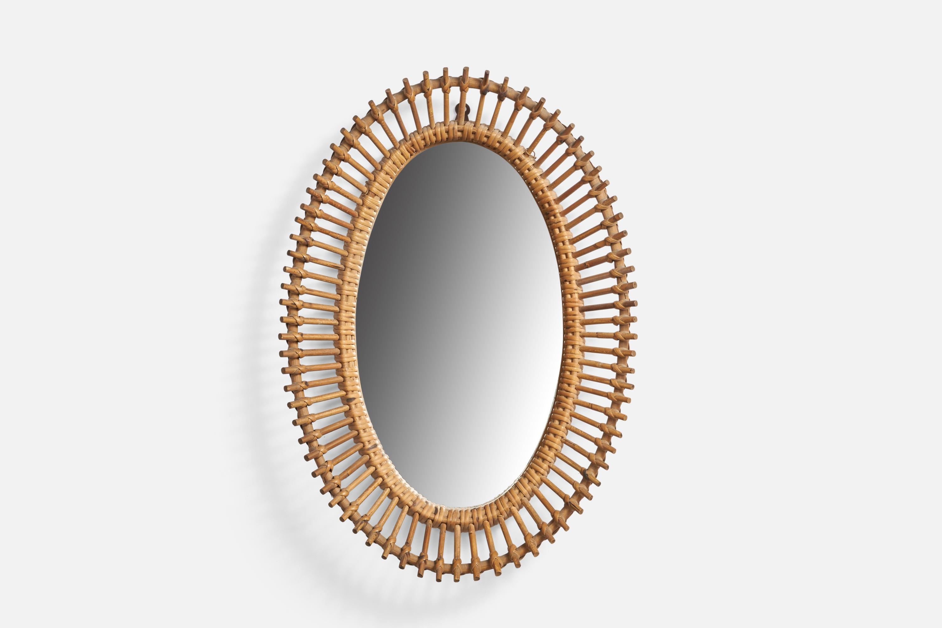 A rattan wall mirror designed and produced in Italy, 1960s.
