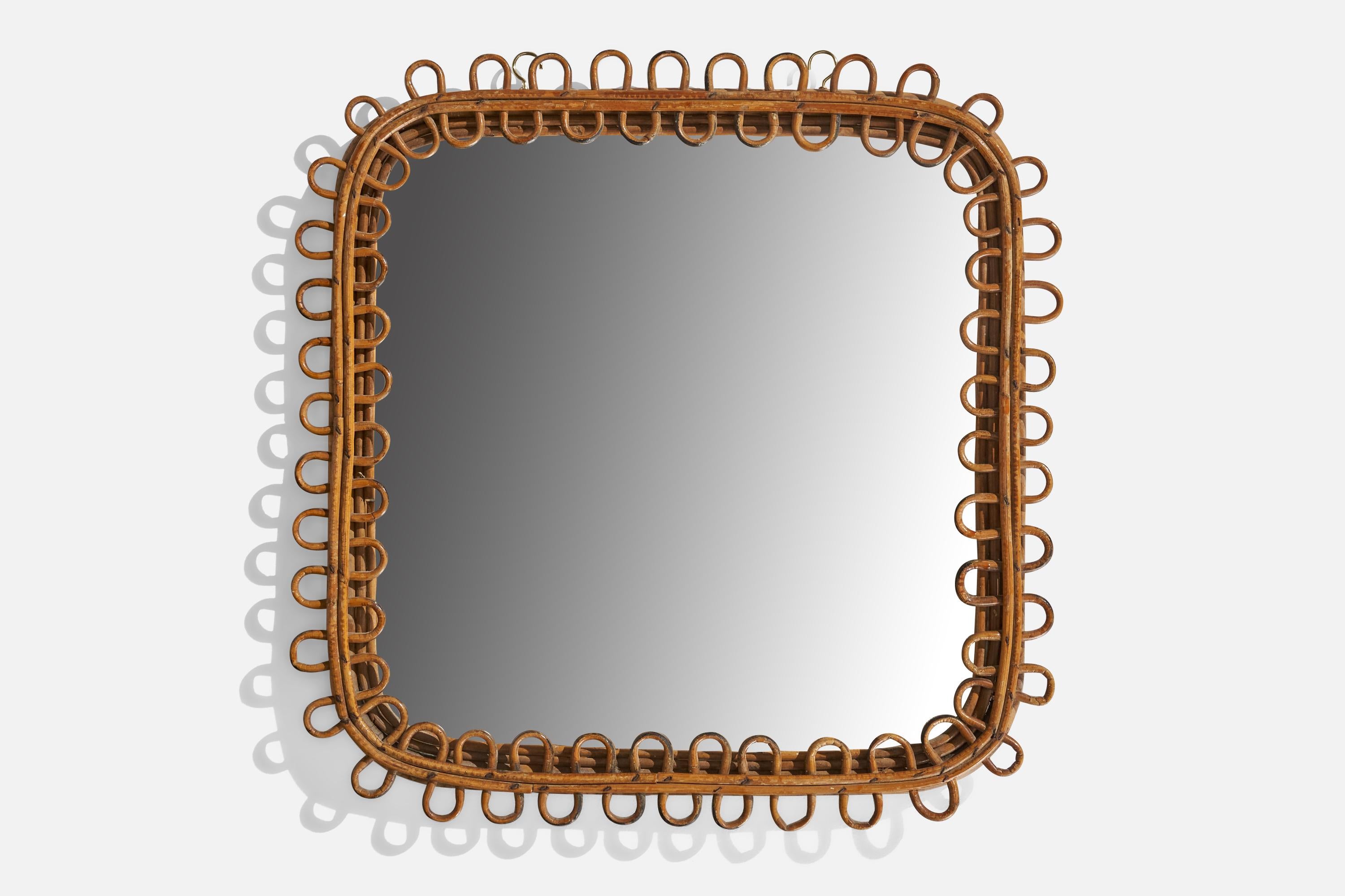 A rattan wall mirror designed and produced in Italy, c. 1960s.