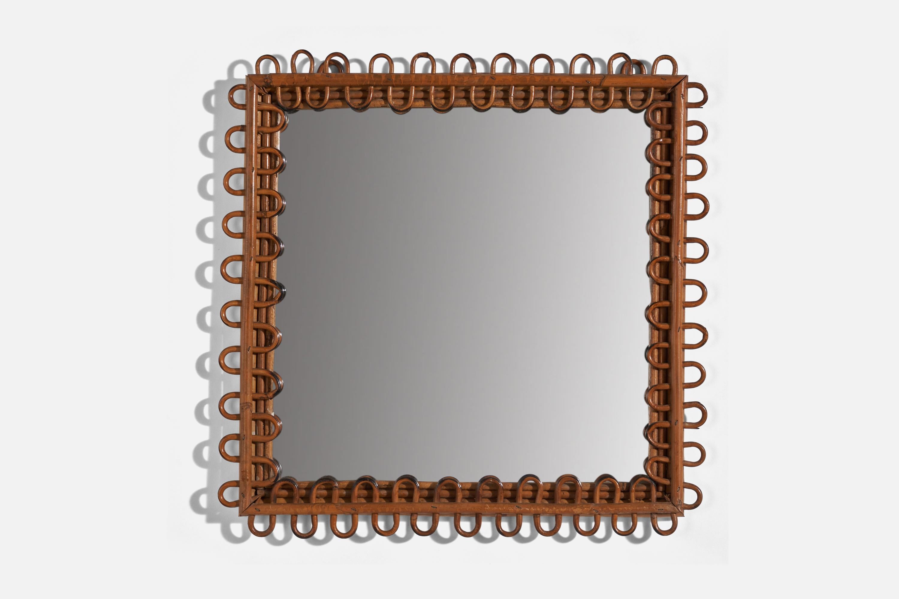 A rattan wall mirror designed and produced in Italy, 1950s. 