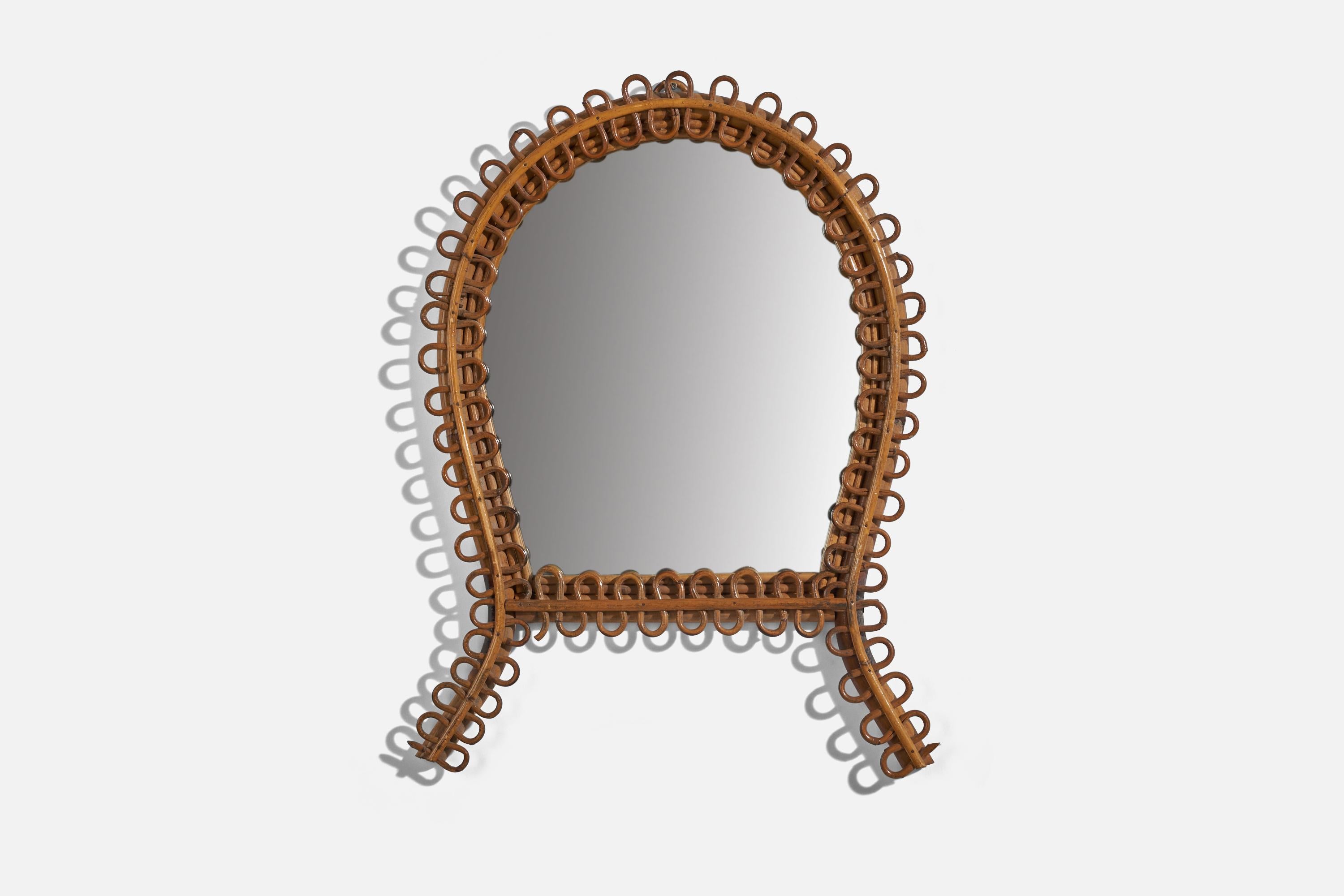 A rattan and bamboo wall mirror designed and produced in Italy, 1950s. 