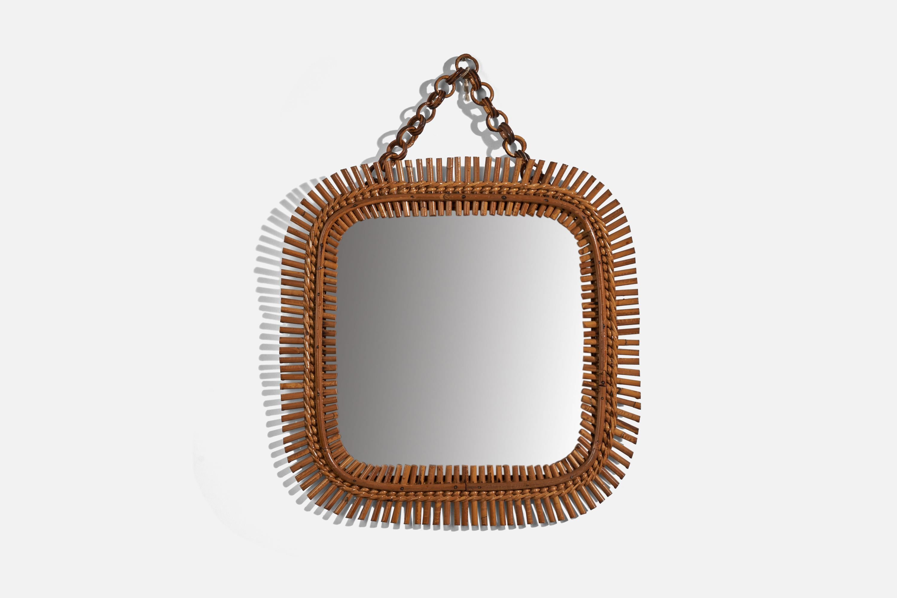 A rattan wall mirror designed and produced in Italy, 1950s. 