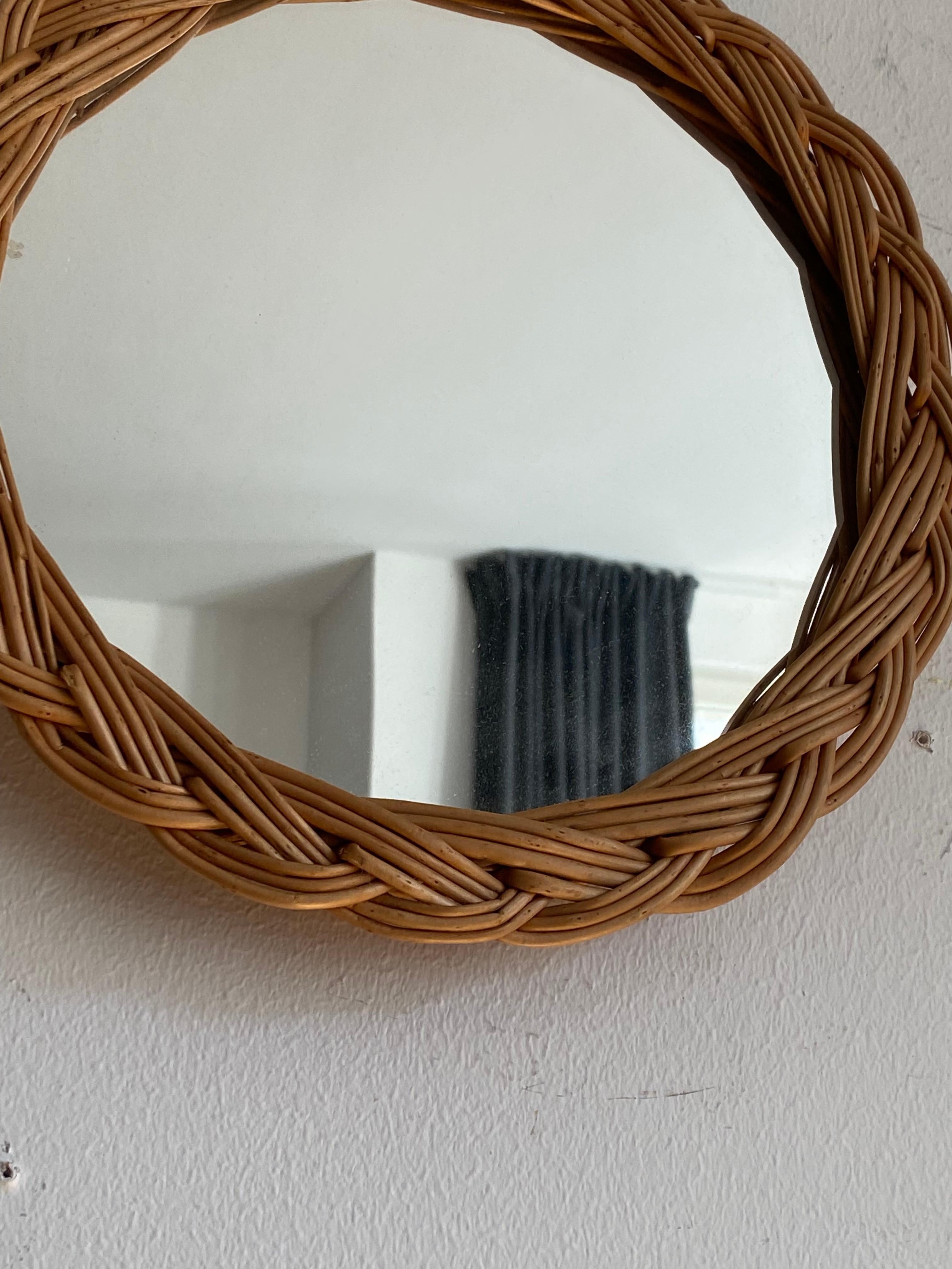 A wall mirror, produced in Italy, c. 1970s. Cut mirror glass is framed in rattan.

Other designers of the period include Gio Ponti, Fontana Arte, Max Ingrand, Franco Albini, and Josef Frank.