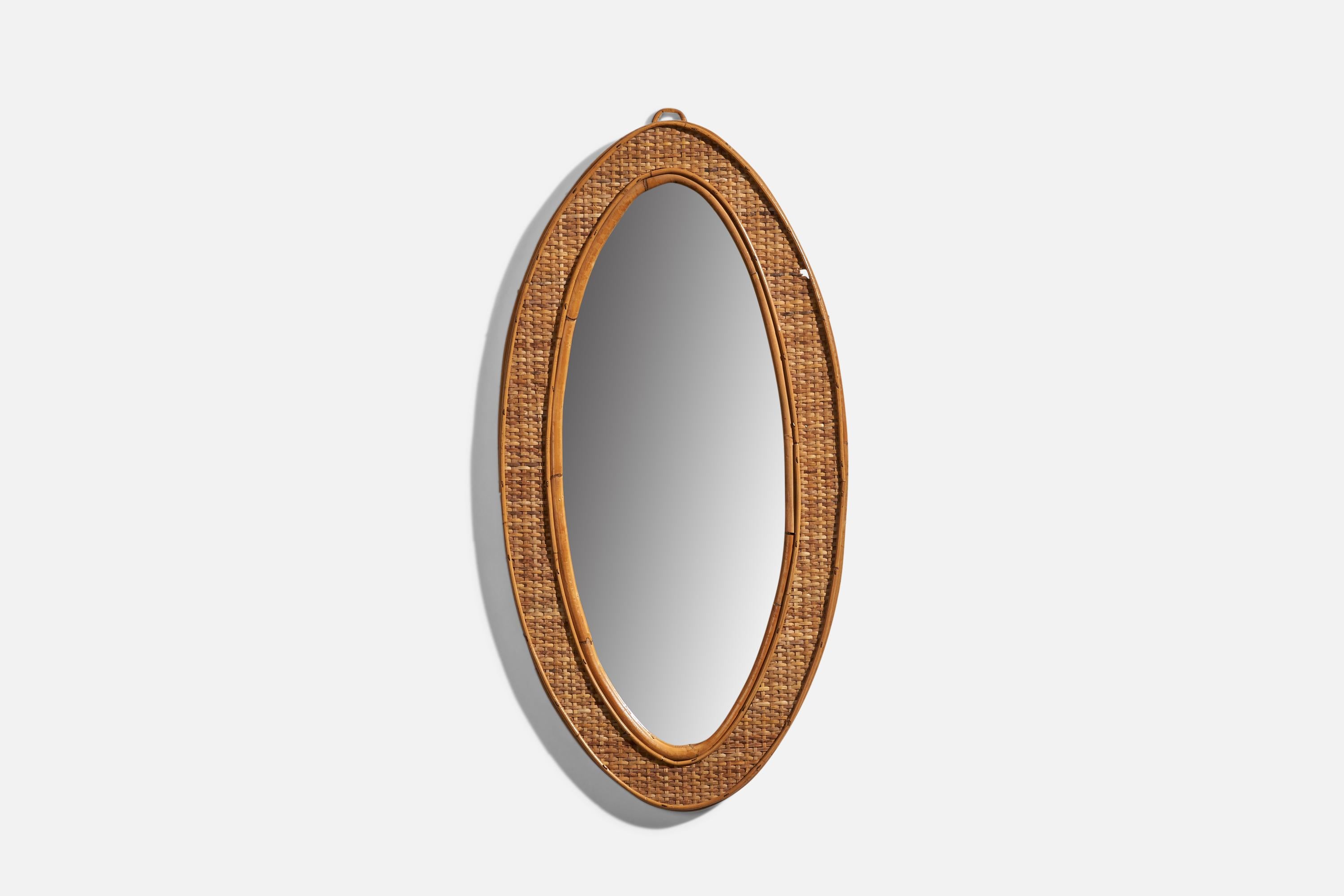 A rattan wall mirror designed and produced in Italy, 1970s.