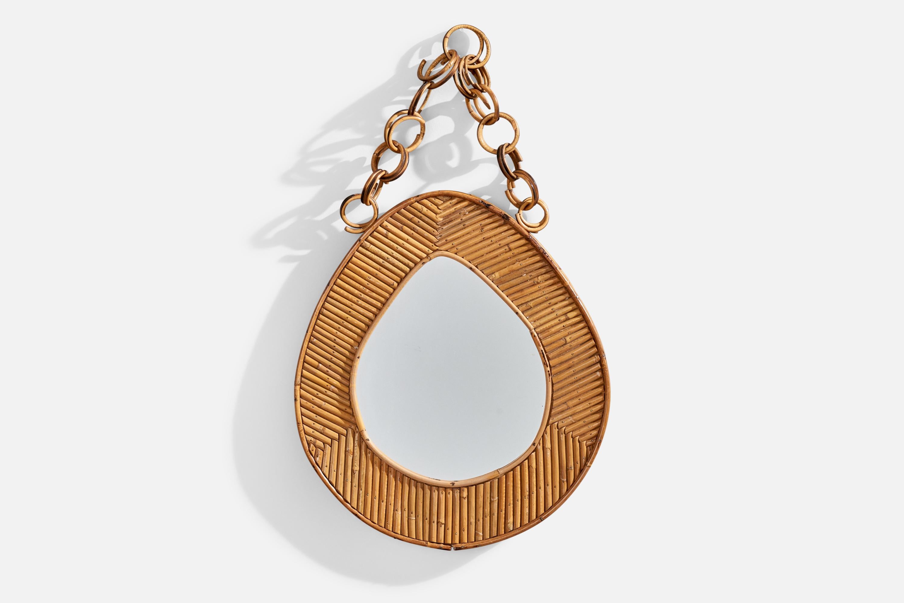 A rattan wall mirror designed and produced by an Italian designer, Italy, 1950s-1960s.
 