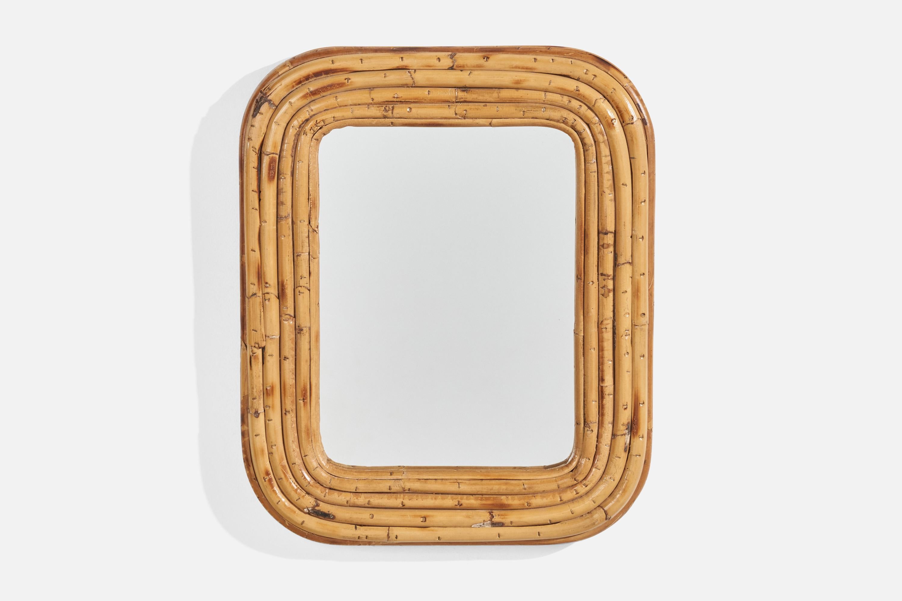 A rattan wall mirror designed and produced by an Italian designer, Italy, 1950s-1960s.
  