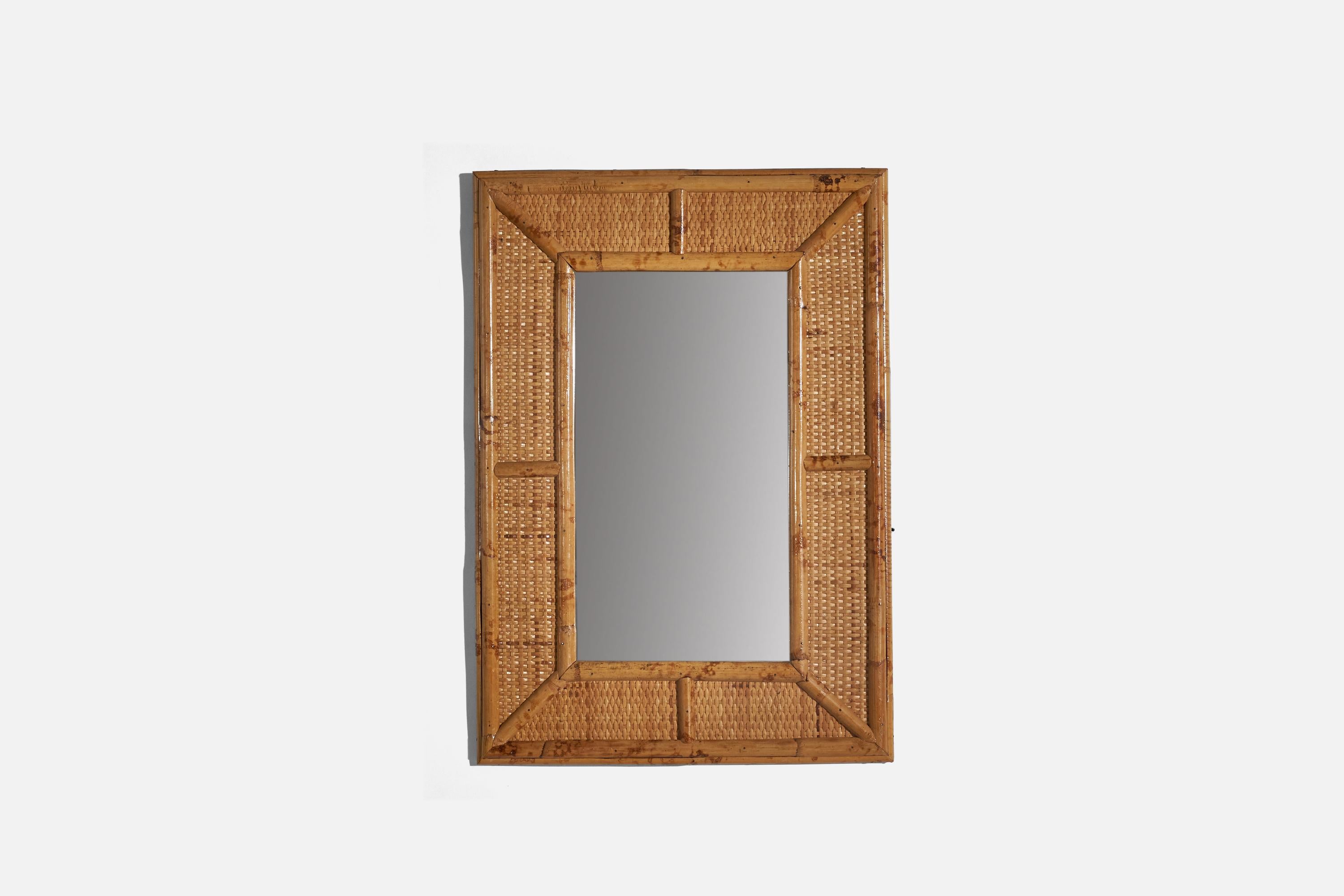 A rattan wall mirror designed and produced by an Italian designer, Italy, c. 1960s.
 