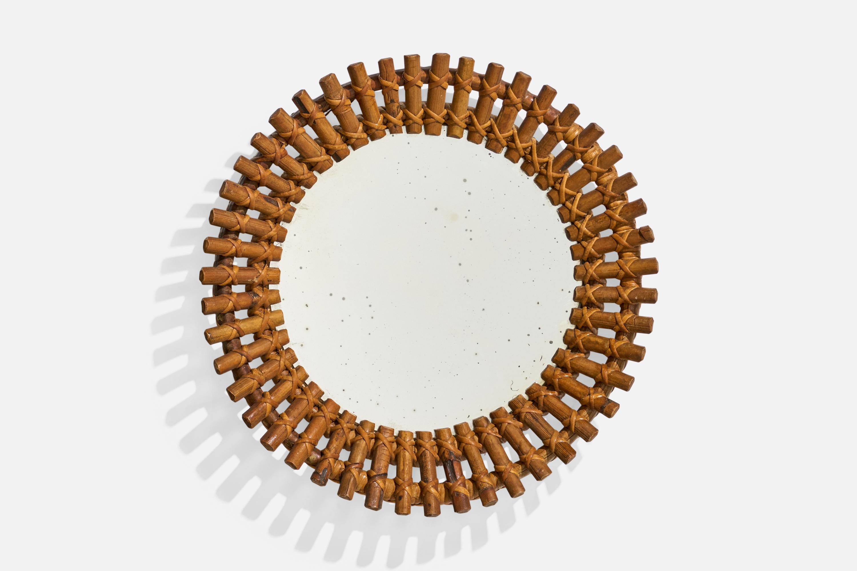 Un miroir mural en rotin conçu et produit par un designer italien, Italie, c. 1960s.
 