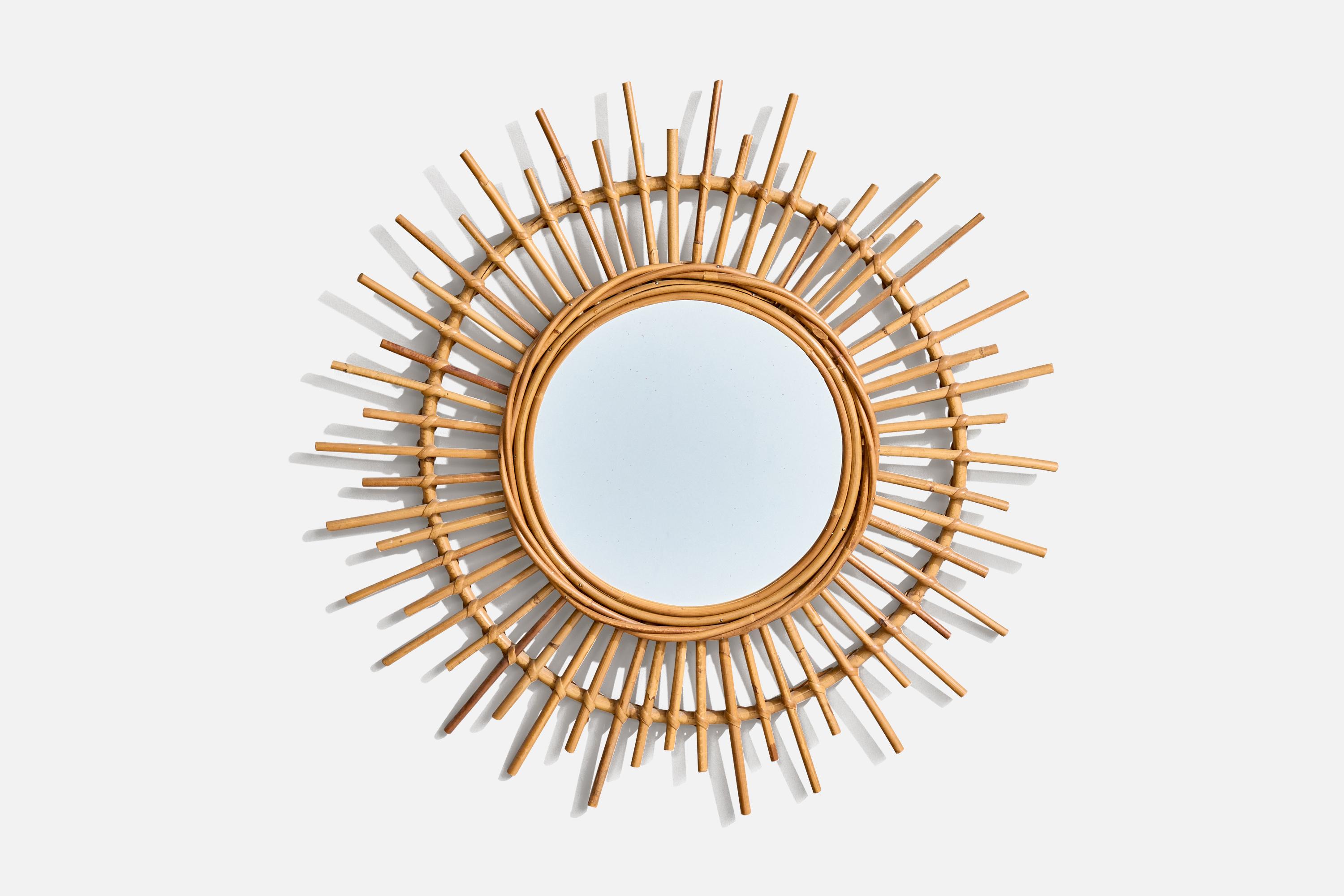 A rattan wall mirror designed and produced by an Italian designer, Italy, c. 1960s.
 