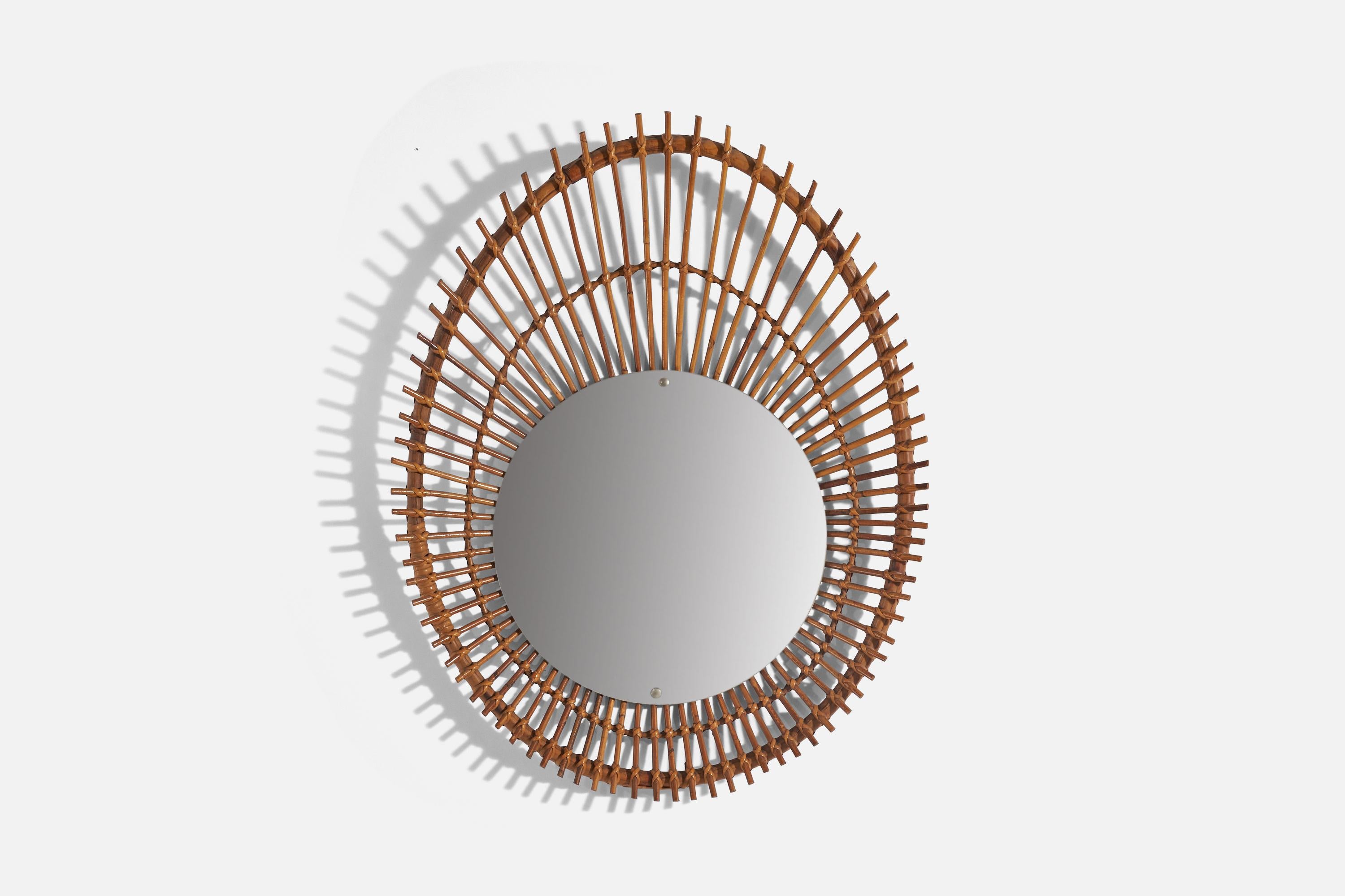 A rattan wall mirror designed and produced by an Italian designer, Italy, c. 1960s.
   