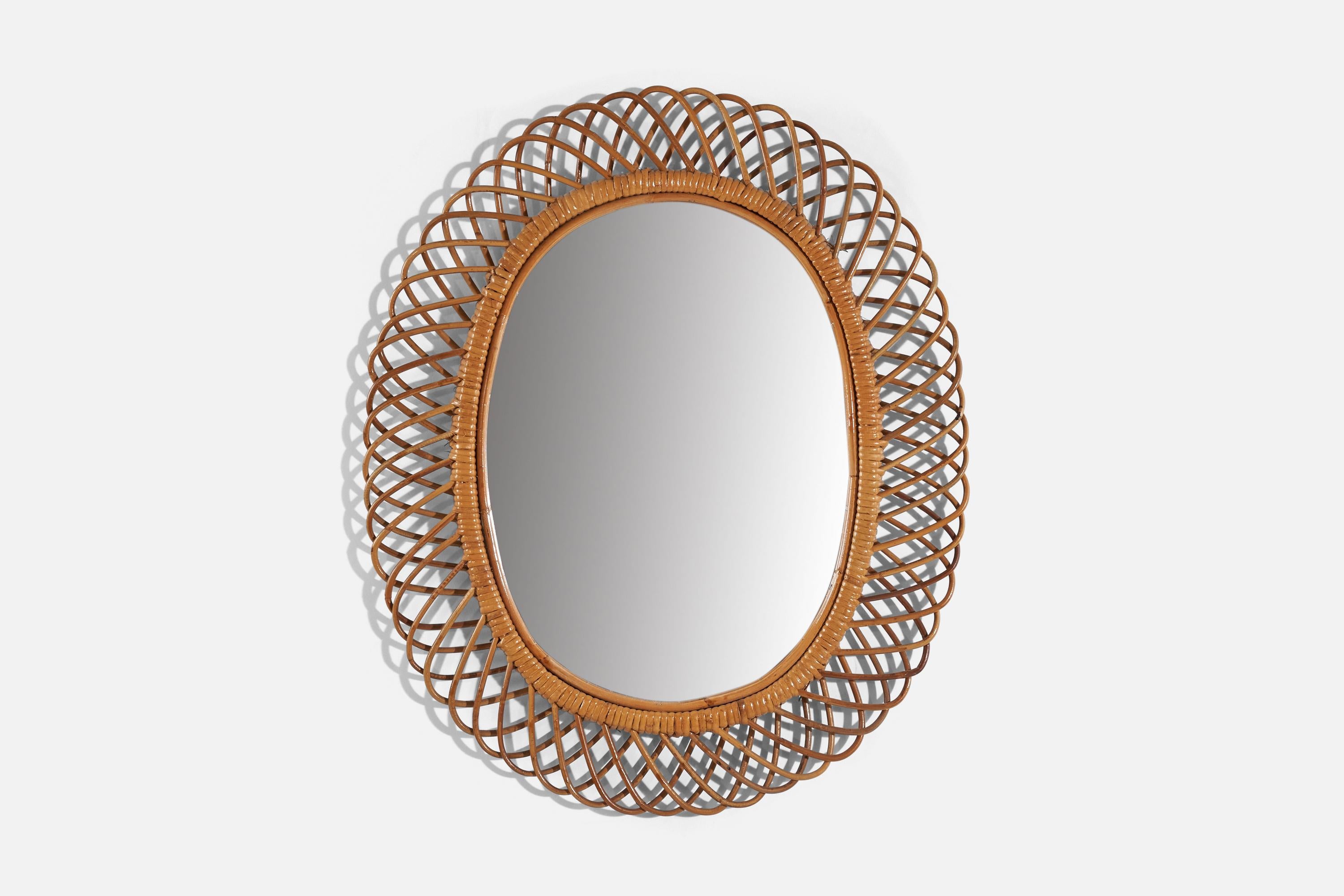 A rattan wall mirror designed and produced by an Italian designer, Italy, 1950s-1960s.
 