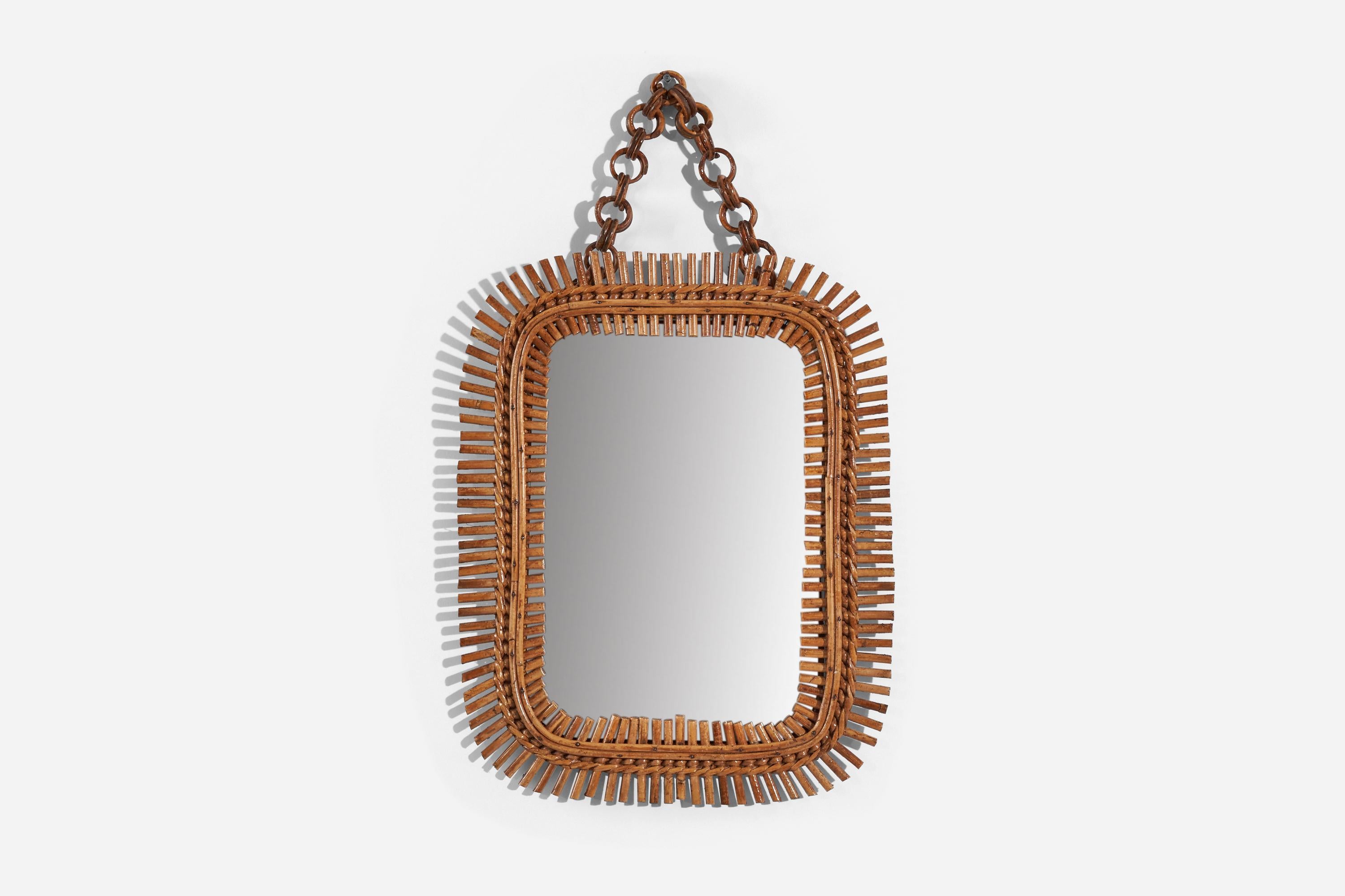 A rattan wall mirror designed and produced by an Italian designer, Italy, 1950s-1960s.
 