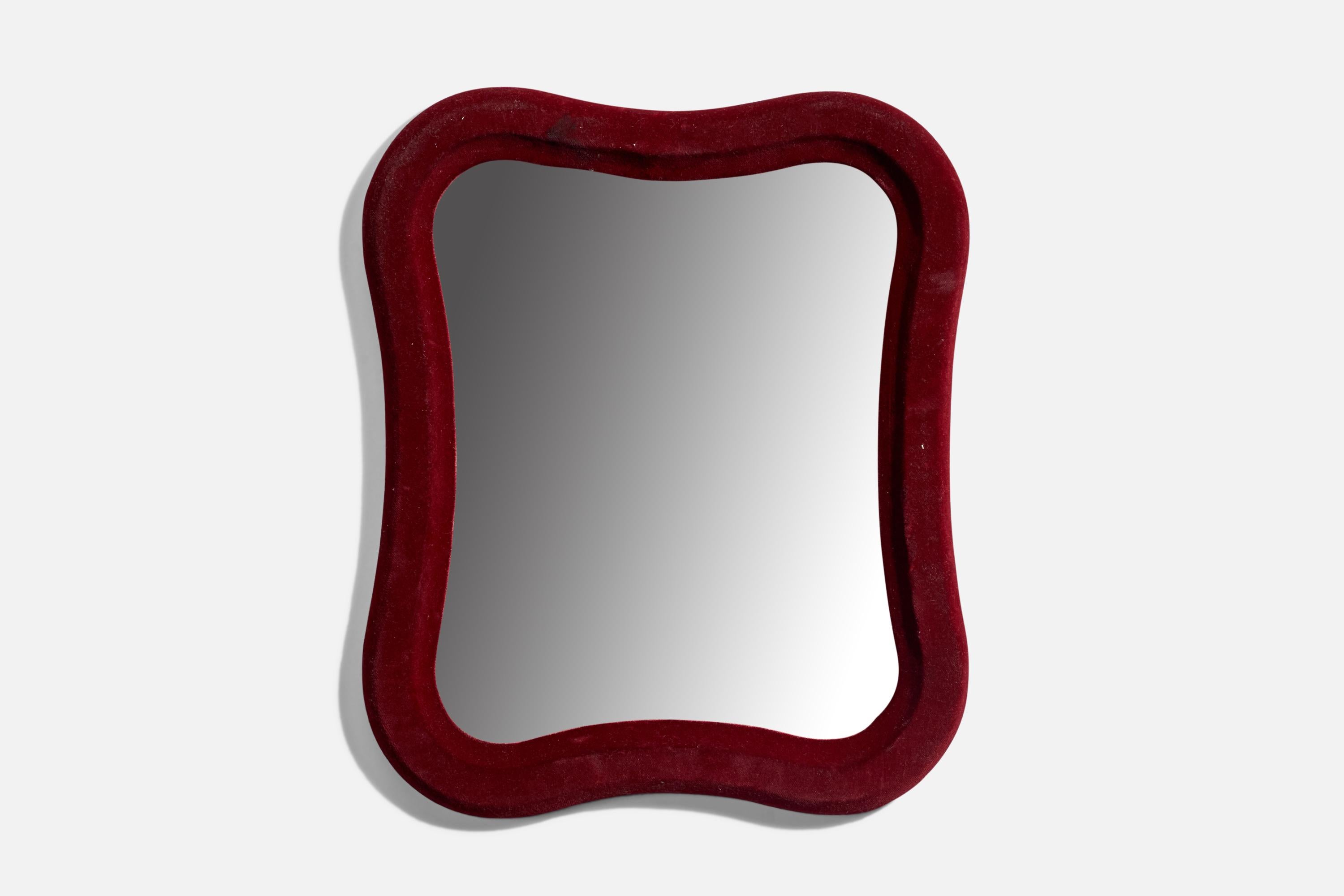 A red velvet wall mirror designed and produced in Italy, 1970s.