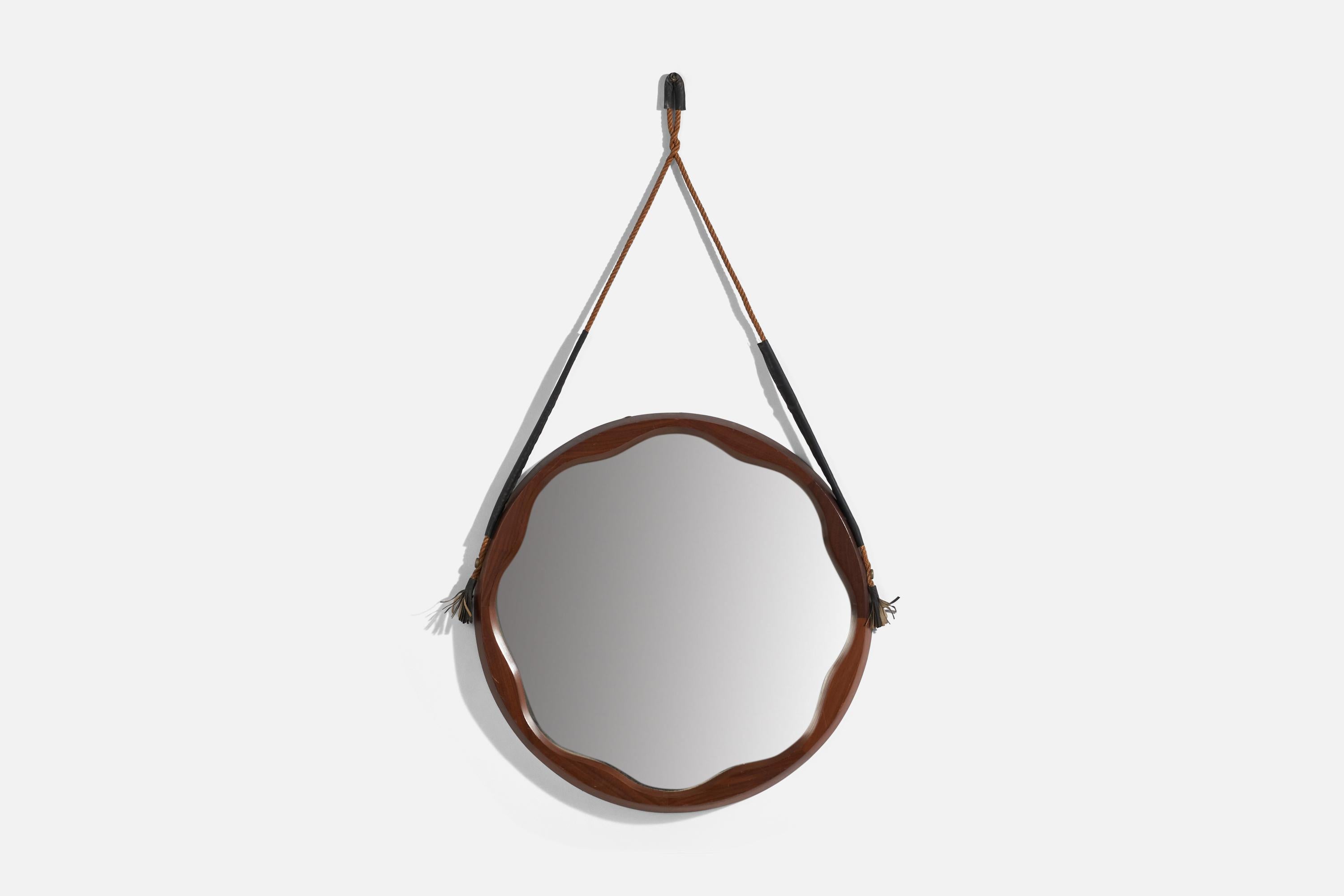 A walnut, cord and rubber wall mirror designed and produced in Italy, 1960s. 