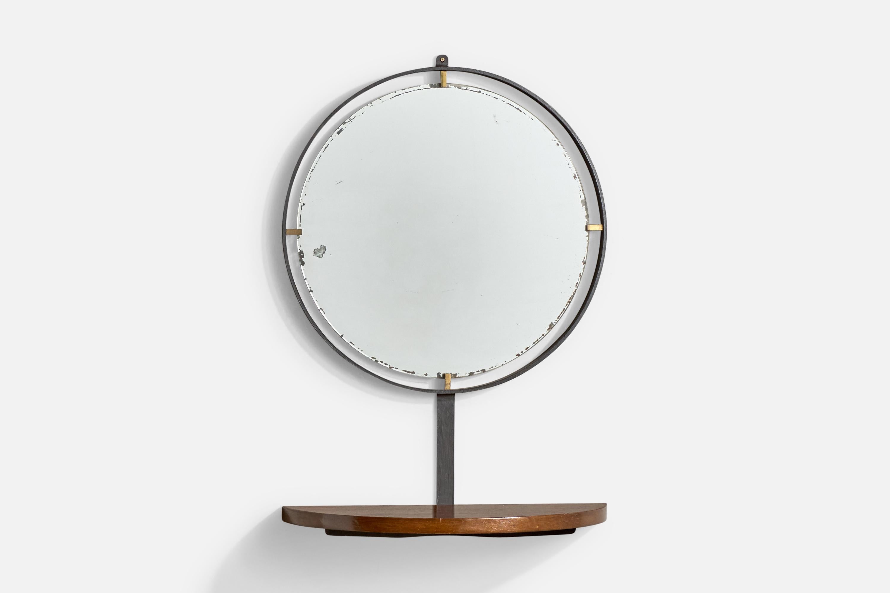 A black-lacquered metal, brass and oak wall mirror with shelf or console designed and produced in Italy, c. 1950s.

Dramatic wear to silvering at edges of mirror.

Overall Dimensions: 30” H x 21” W x 10” D

Mirror Dimensions: 21.5” H x 21” W x 1.3”