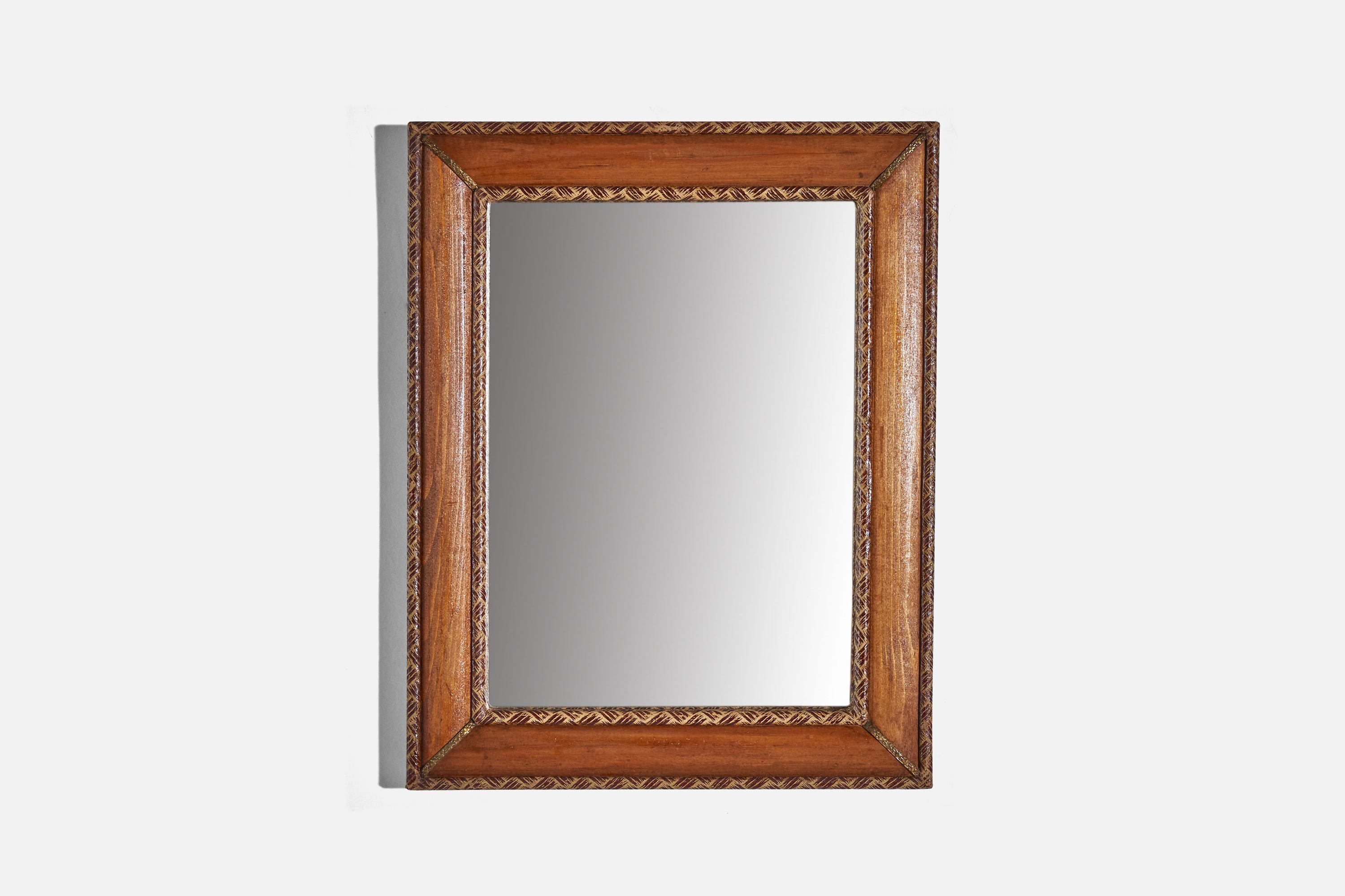A wood, brass and leather wall mirror designed and produced in Italy, c. 1930s.
  