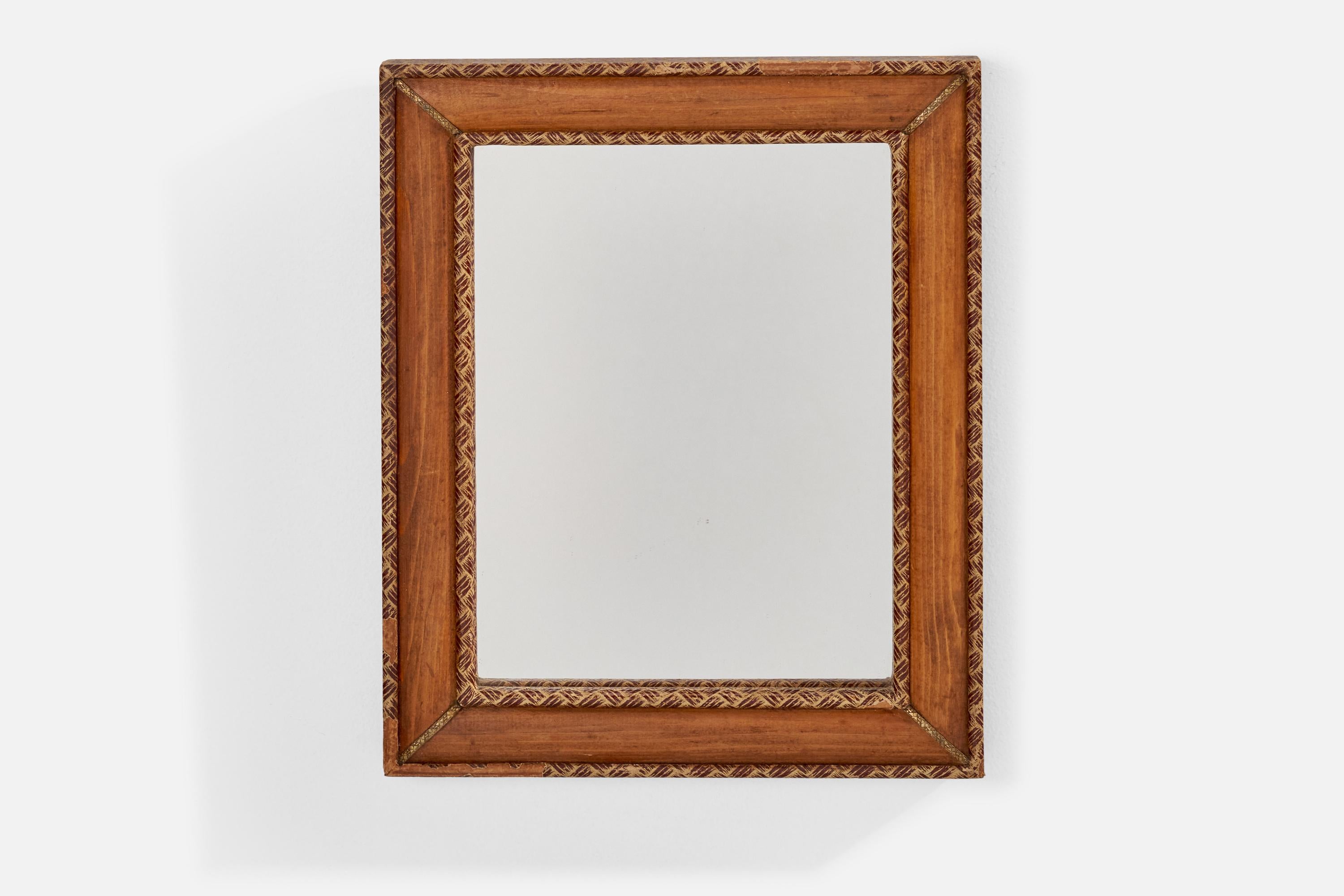 A wood, brass and leather wall mirror designed and produced in Italy, c. 1930s.
  