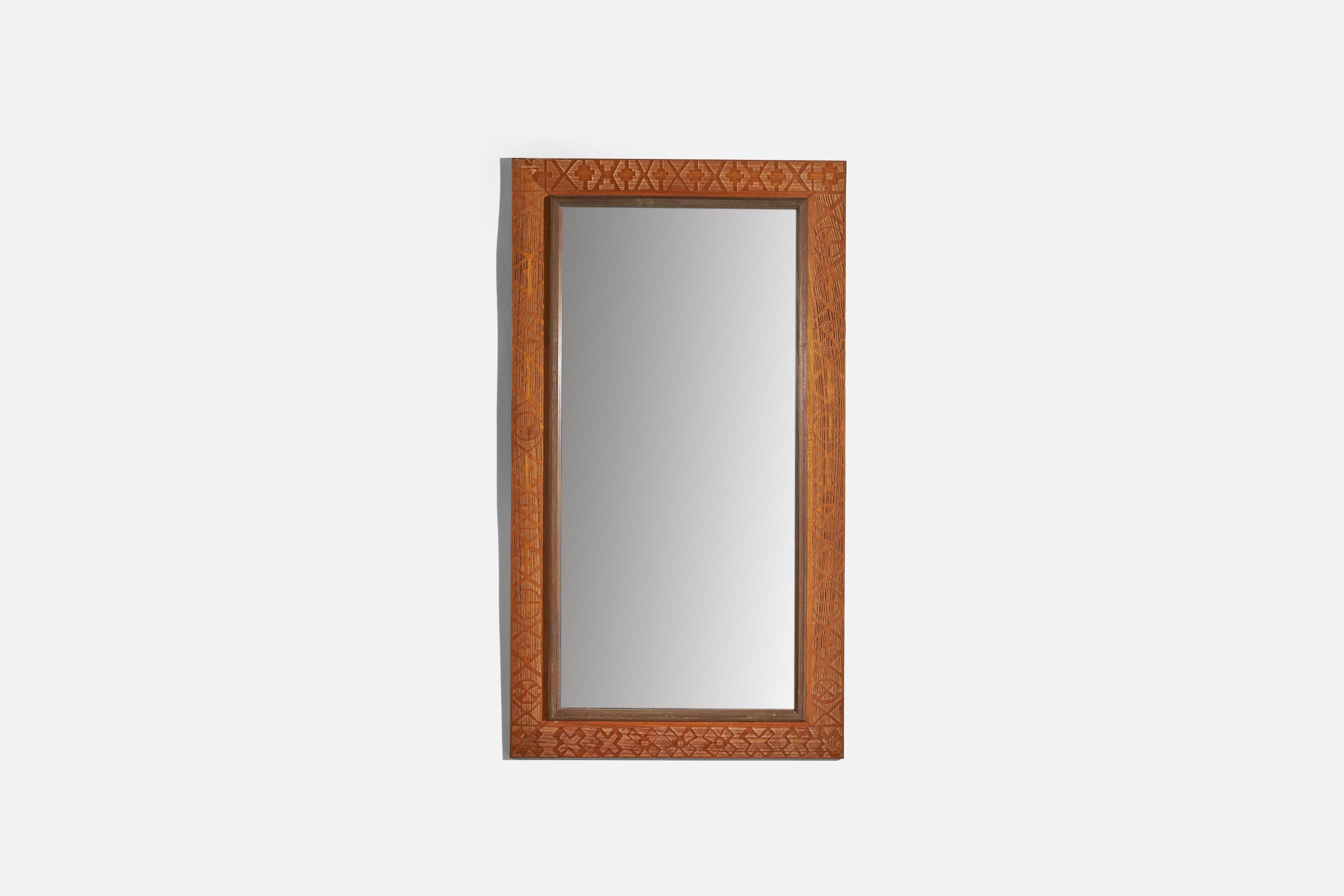 A carved wooden wall mirror designed and produced in Italy, c. 1930s.
 
