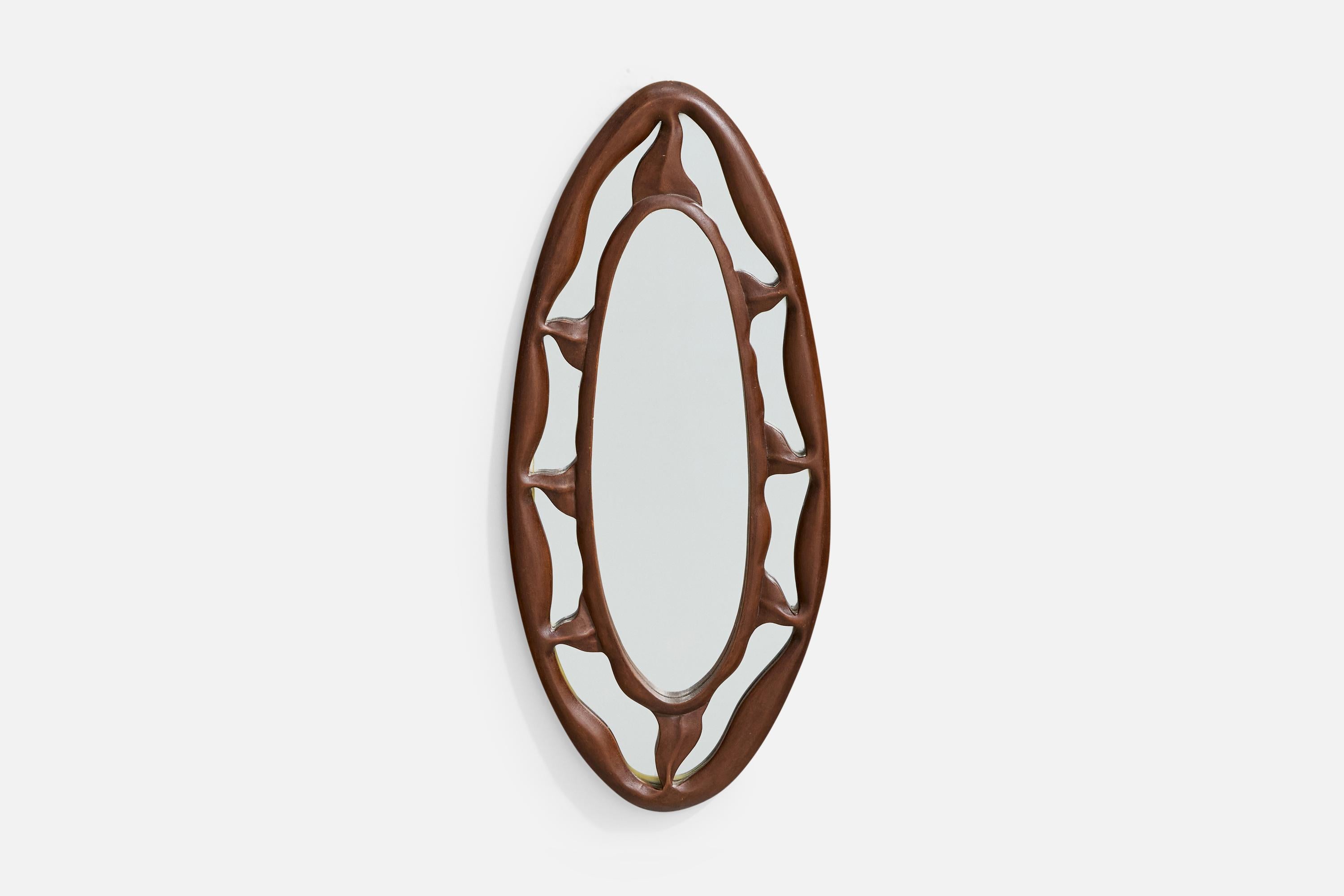 Miroir mural en bois sculpté, conçu et produit en Italie, c.C. 1950.

Dimensions globales (pouces) : 26.25 